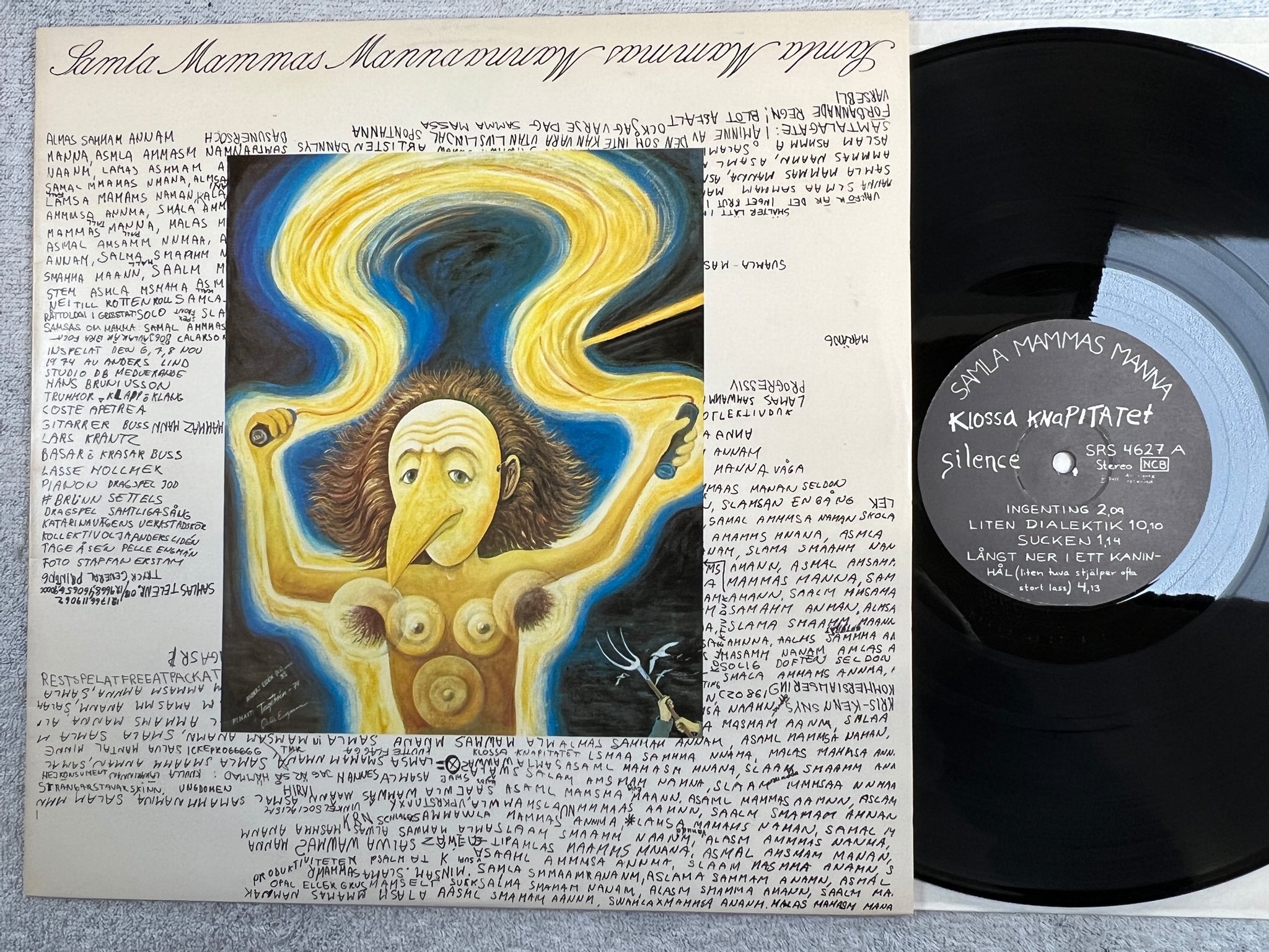 Omslagsbild för skivan SAMLA MAMMAS MANNA klossa knapitalet LP -74 Swe SILENCE SRS 4627