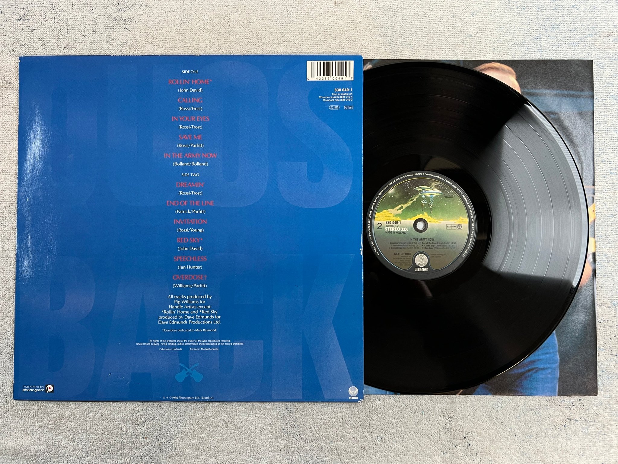 Omslagsbild för skivan STATUS QUO in the army now LP -86 Hol VERTIGO 830 049-1