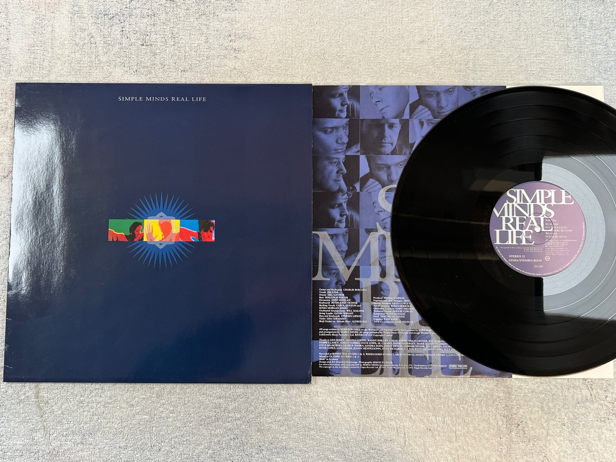 Omslagsbild för skivan SIMPLE MINDS real life LP -91 Hol VIRGIN 211393