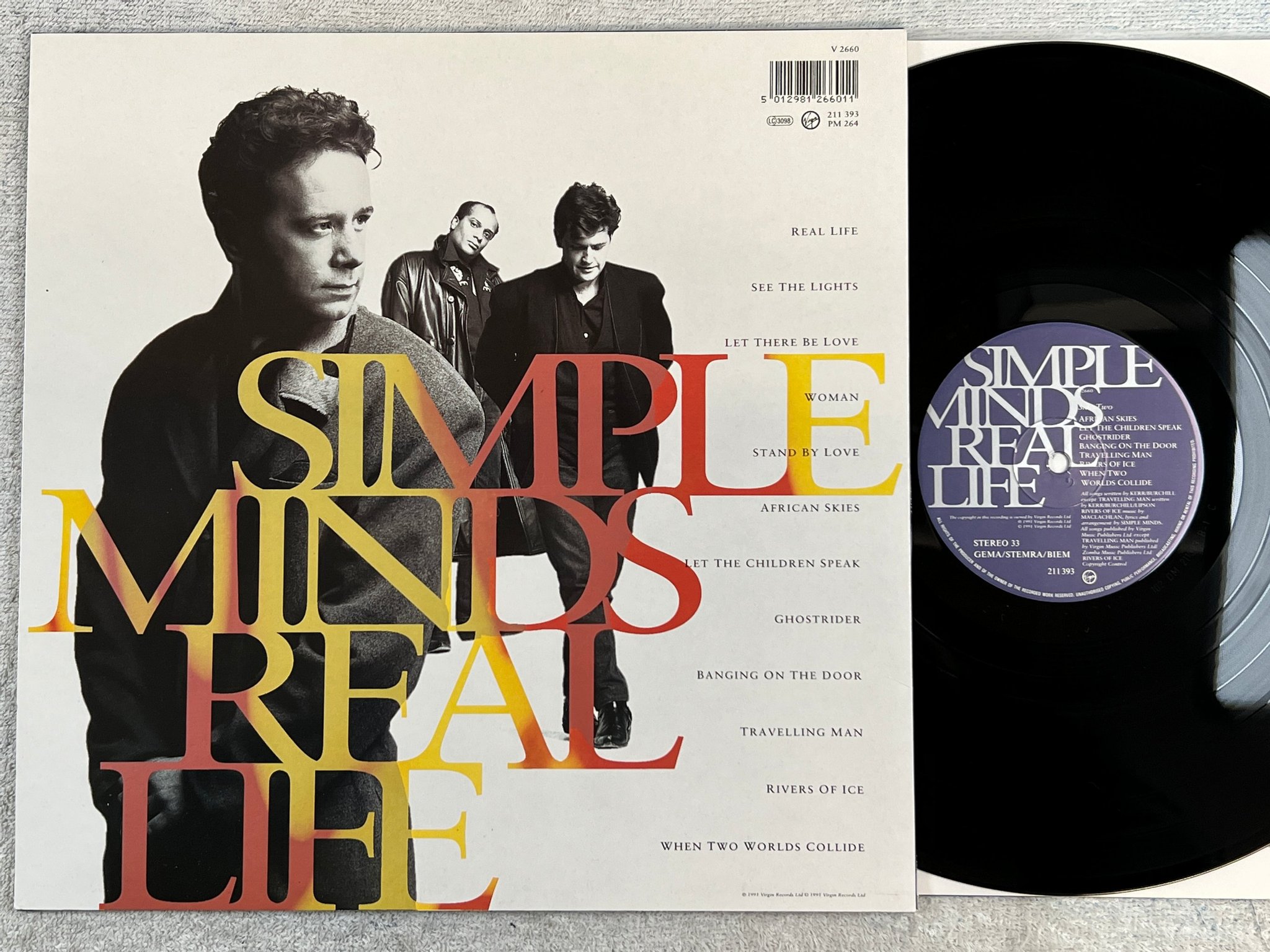 Omslagsbild för skivan SIMPLE MINDS real life LP -91 Hol VIRGIN 211393