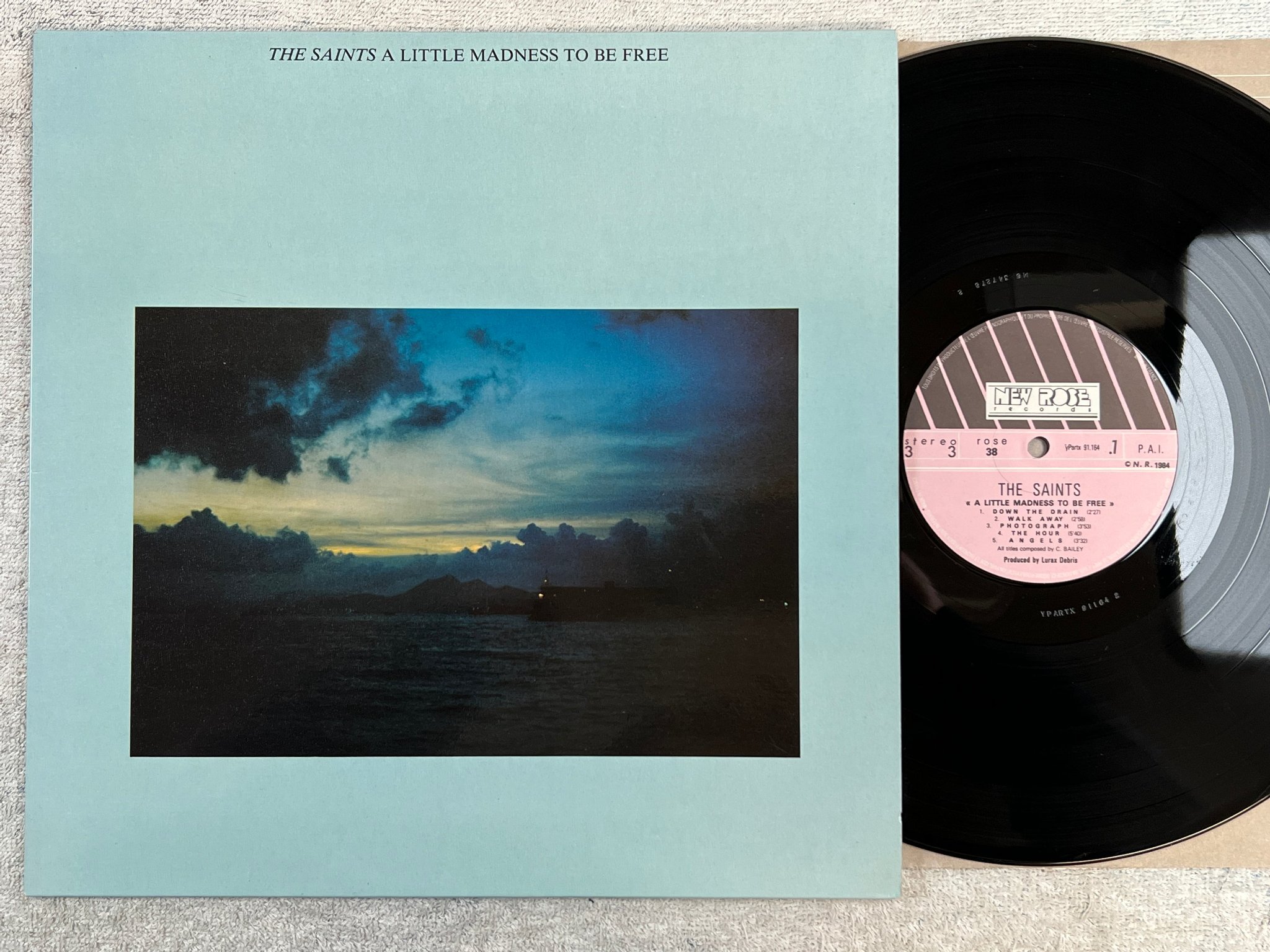 Omslagsbild för skivan THE SAINTS a little madness to be free LP -84 fra NEW ROSE ROSE 38