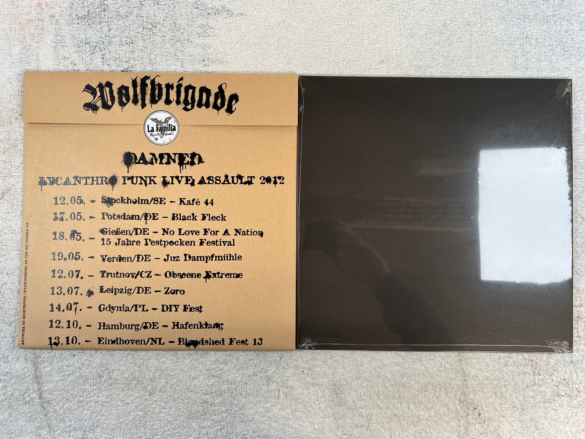 Omslagsbild för skivan WOLFBRIGADE damned LP 2012 Ger LA FAMILIA MEMBER 40+16 hardcore STILL SEALED