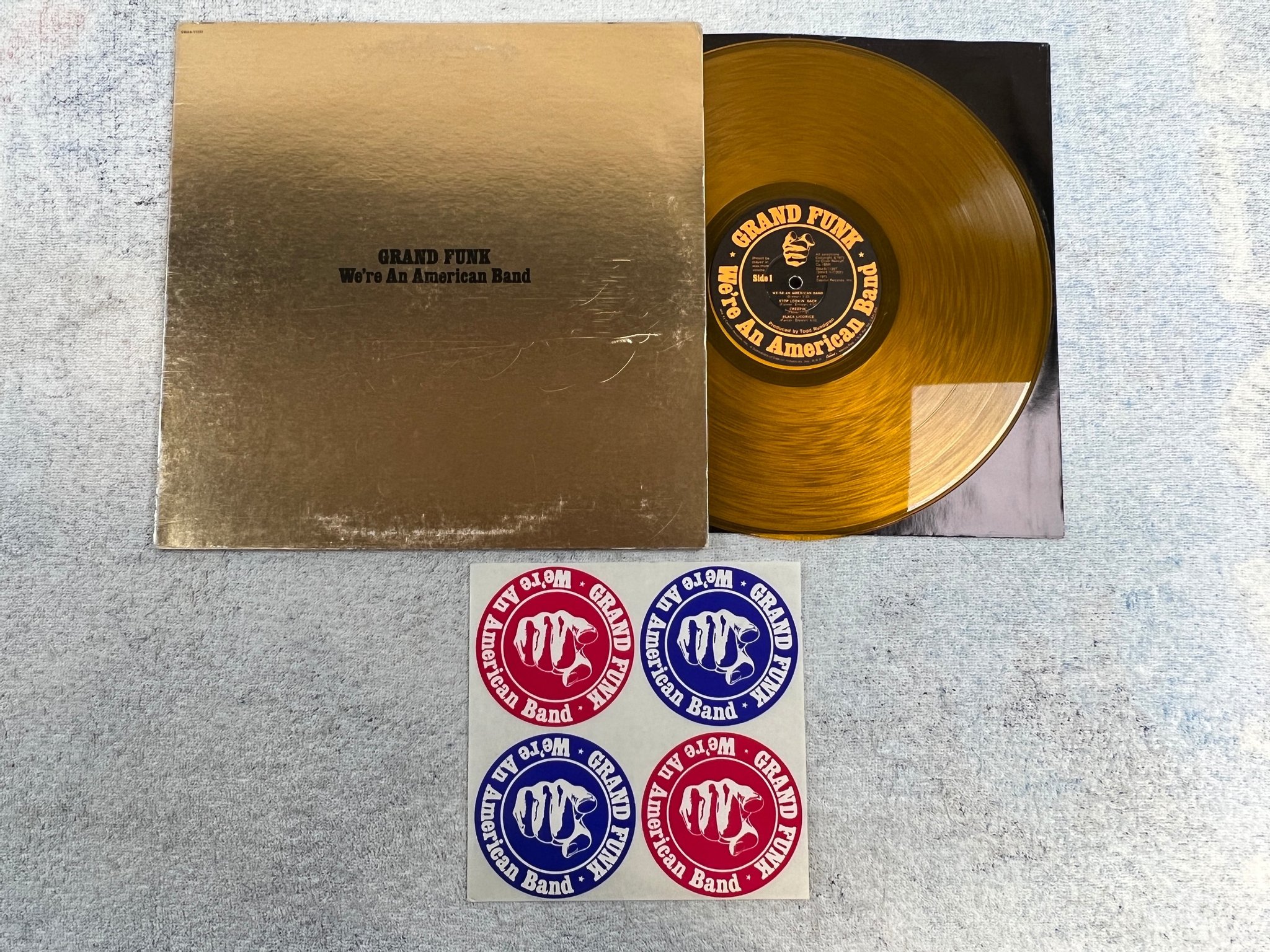 Omslagsbild för skivan GRAND FUNK we're an american band LP -73 US CAPITOL SMAS-11207 w/ stickers