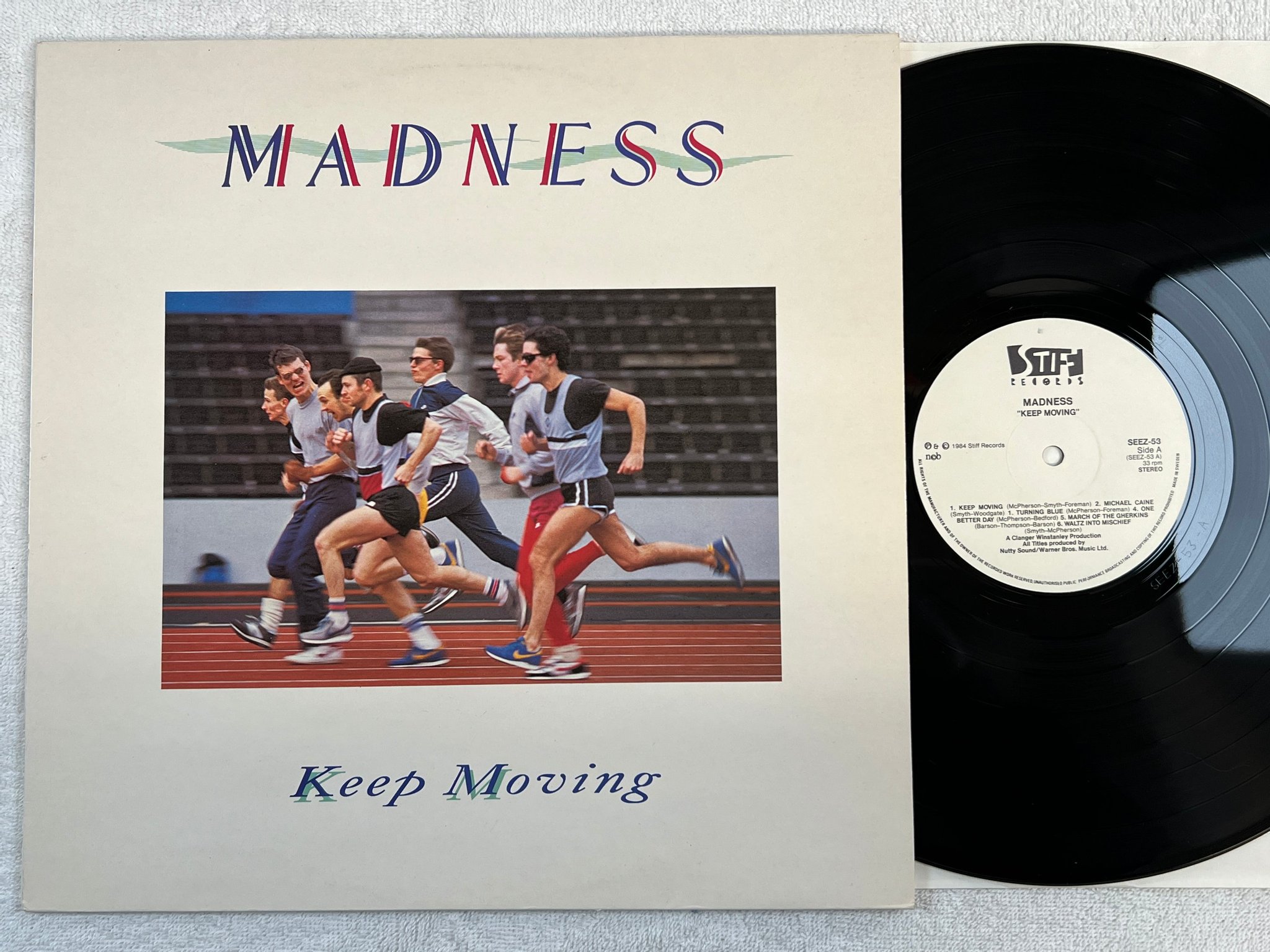 Omslagsbild för skivan MADNESS keep moving LP -84 ncb STIFF SEEZ 53
