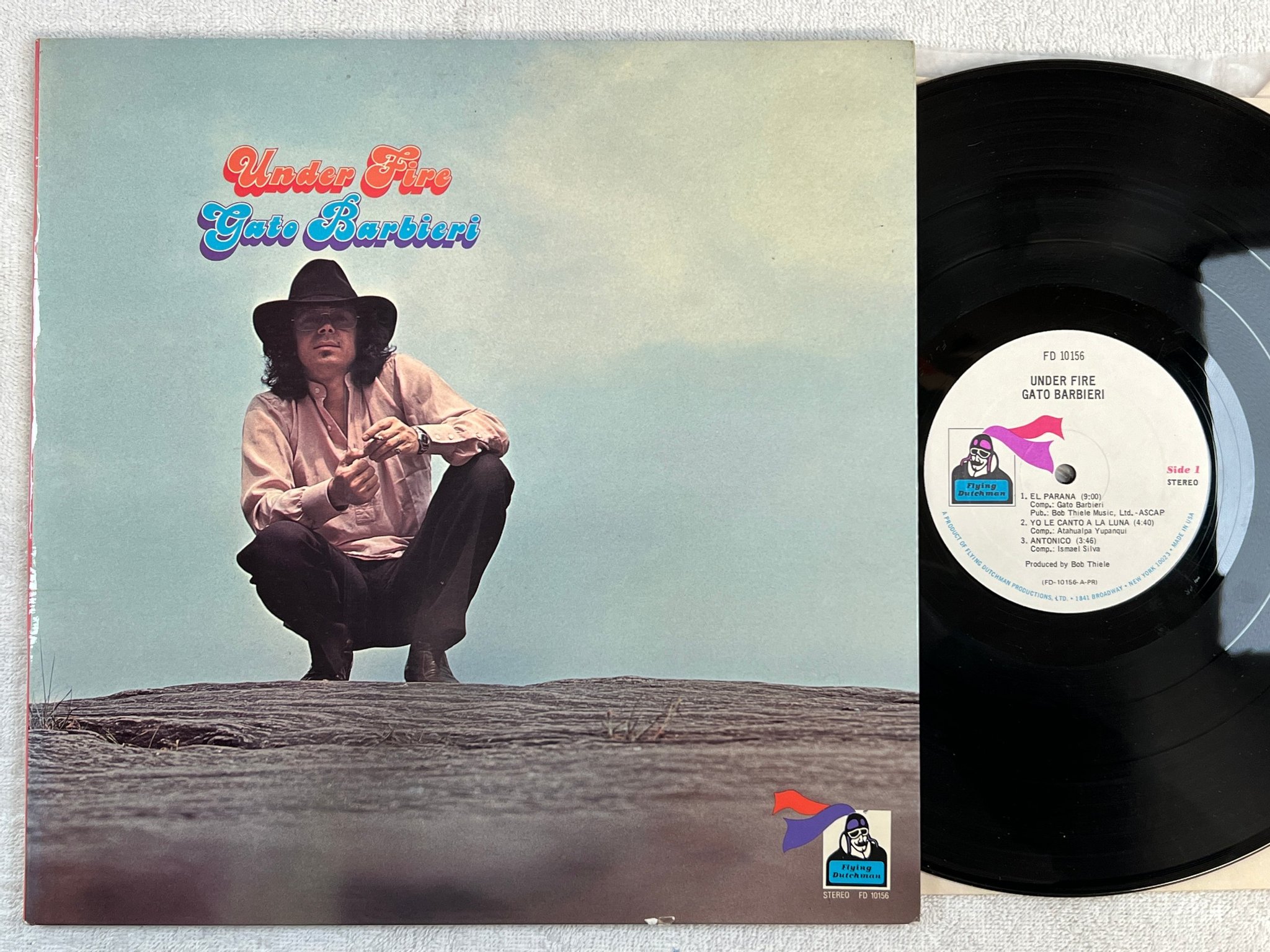 Omslagsbild för skivan GATO BARBIERI under fire LP -73 US FLYING DUTCHMAN FD 10156 latin jazz / fusion