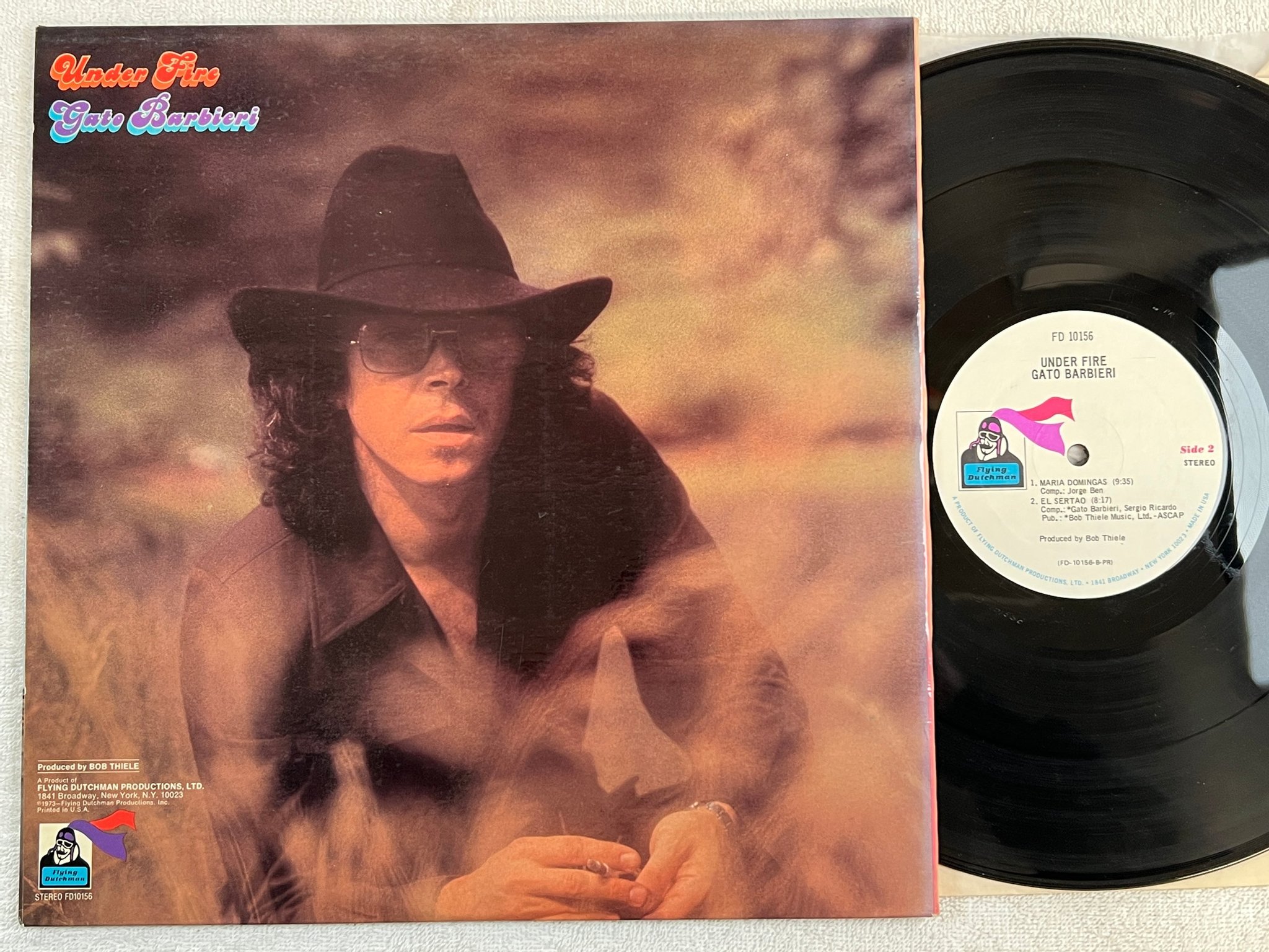 Omslagsbild för skivan GATO BARBIERI under fire LP -73 US FLYING DUTCHMAN FD 10156 latin jazz / fusion