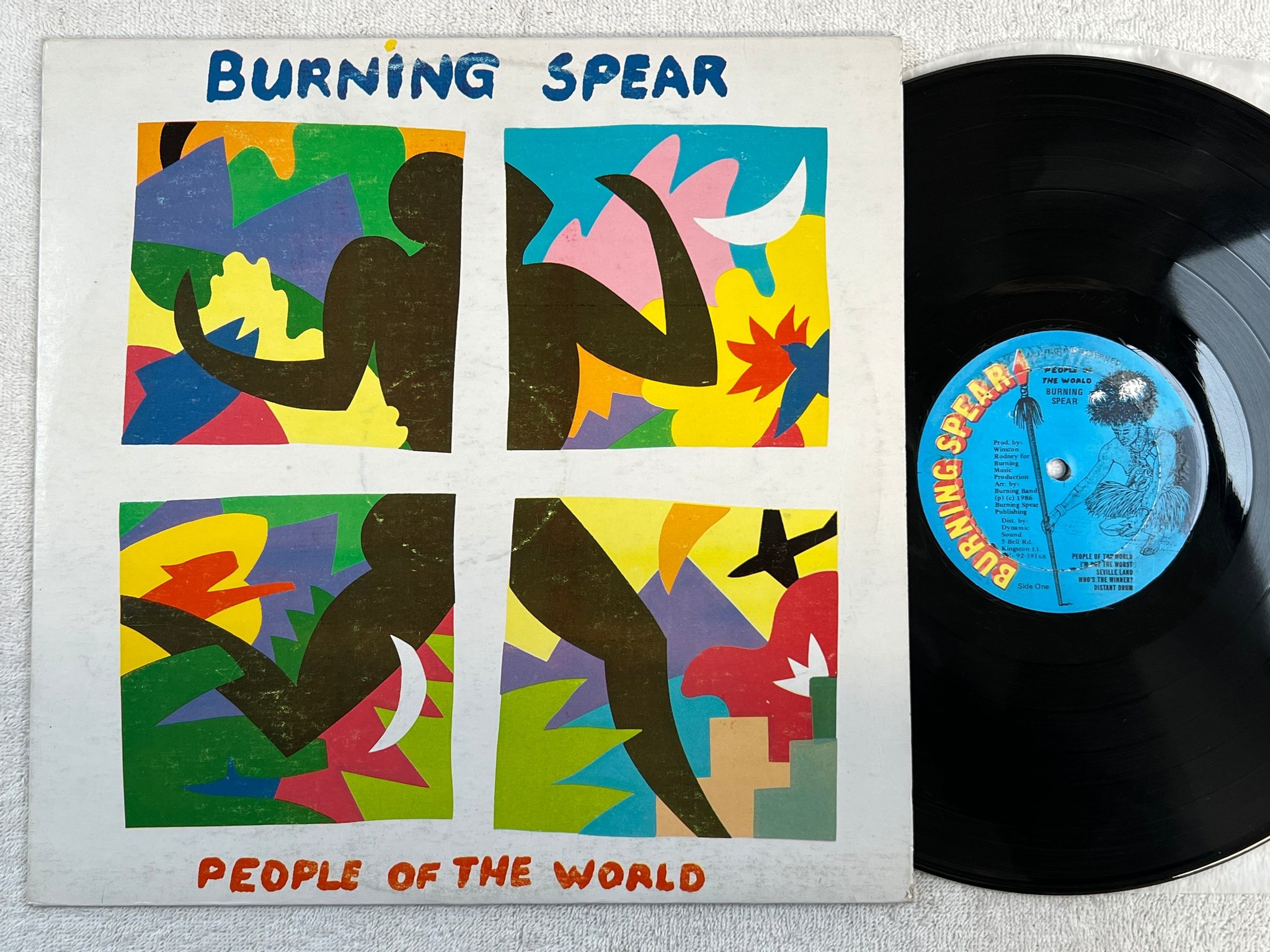 Omslagsbild för skivan BURNING SPEAR people of the world LP 86 Jamaica press 