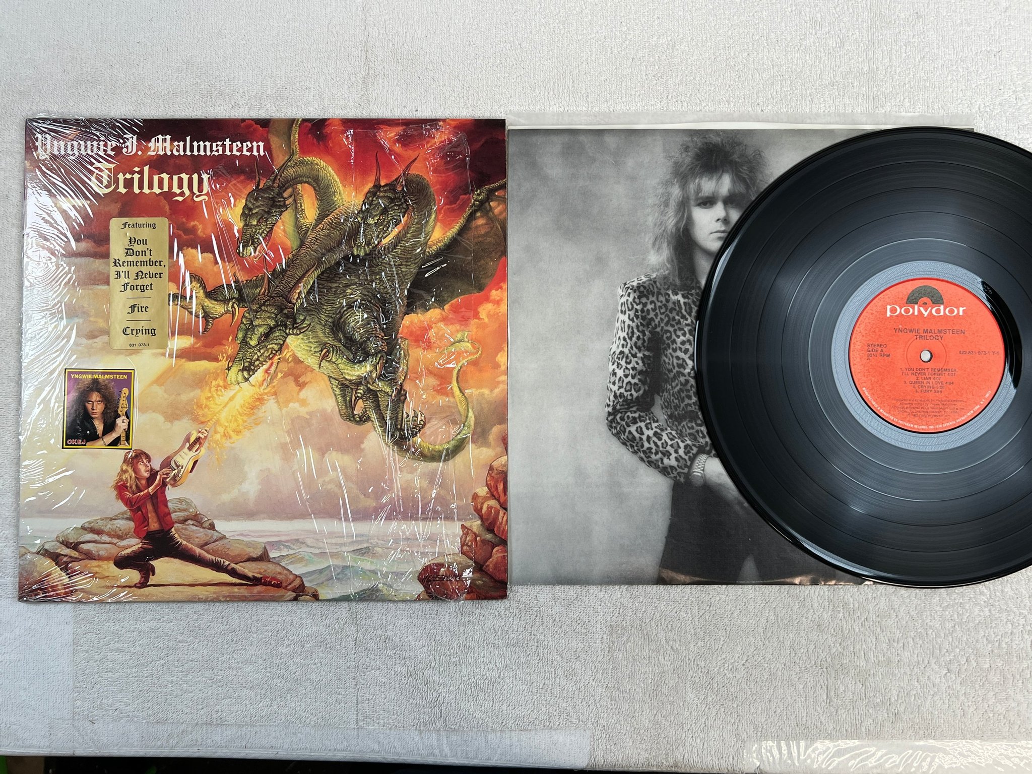 Omslagsbild för skivan YNGWIE MALMSTEEN trilogy LP -86 US POLYDOR 422-831 073-1 Y-1