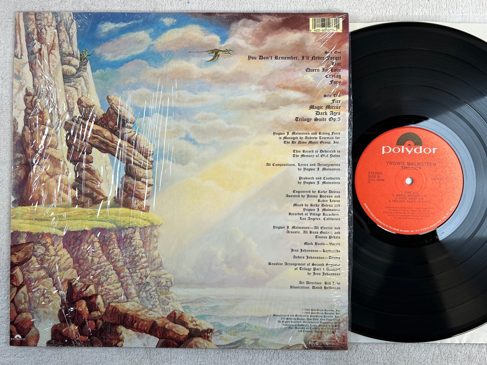 Omslagsbild för skivan YNGWIE MALMSTEEN trilogy LP -86 US POLYDOR 422-831 073-1 Y-1