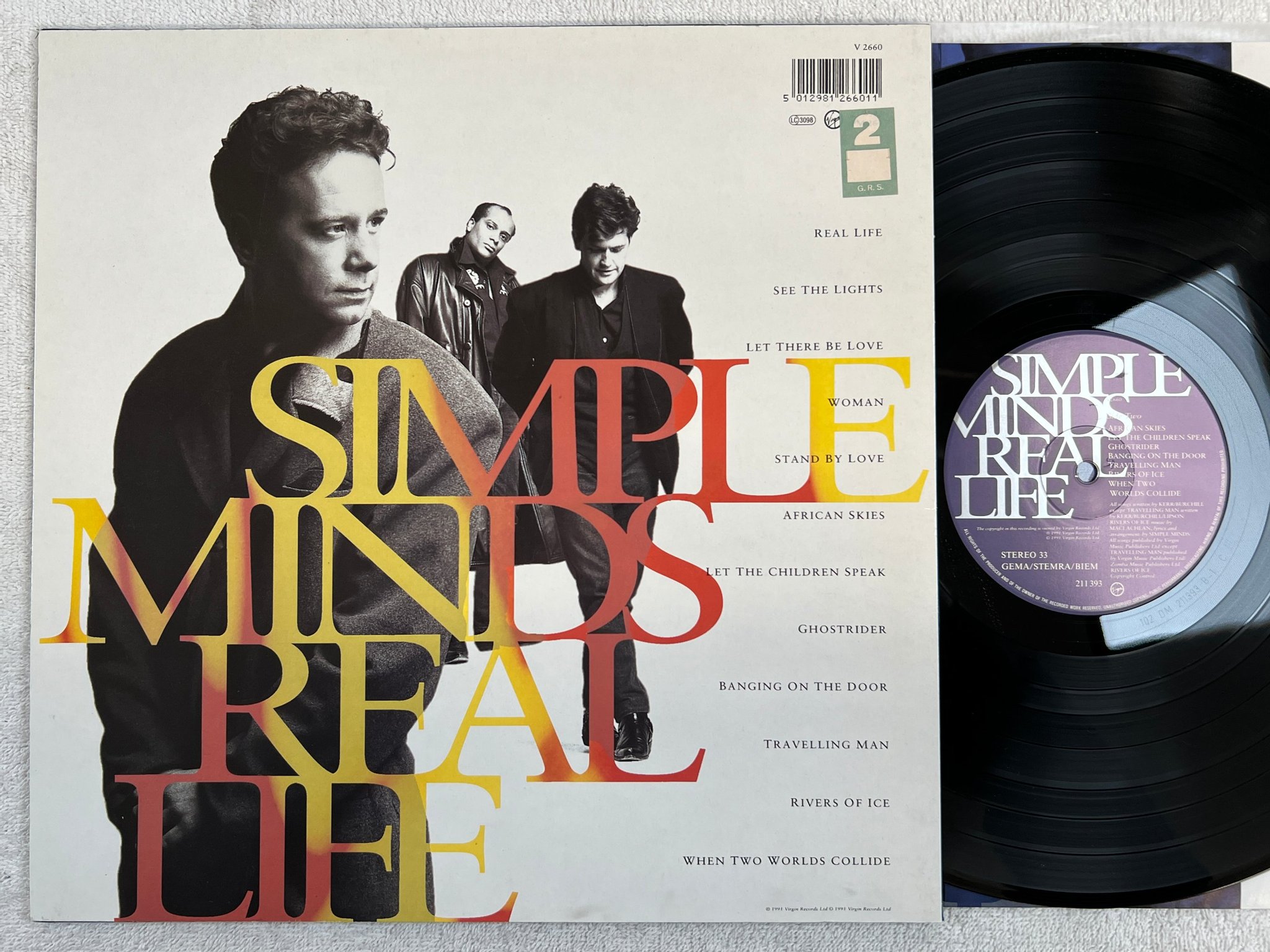 Omslagsbild för skivan SIMPLE MINDS real life LP -91 VIRGIN 211 393
