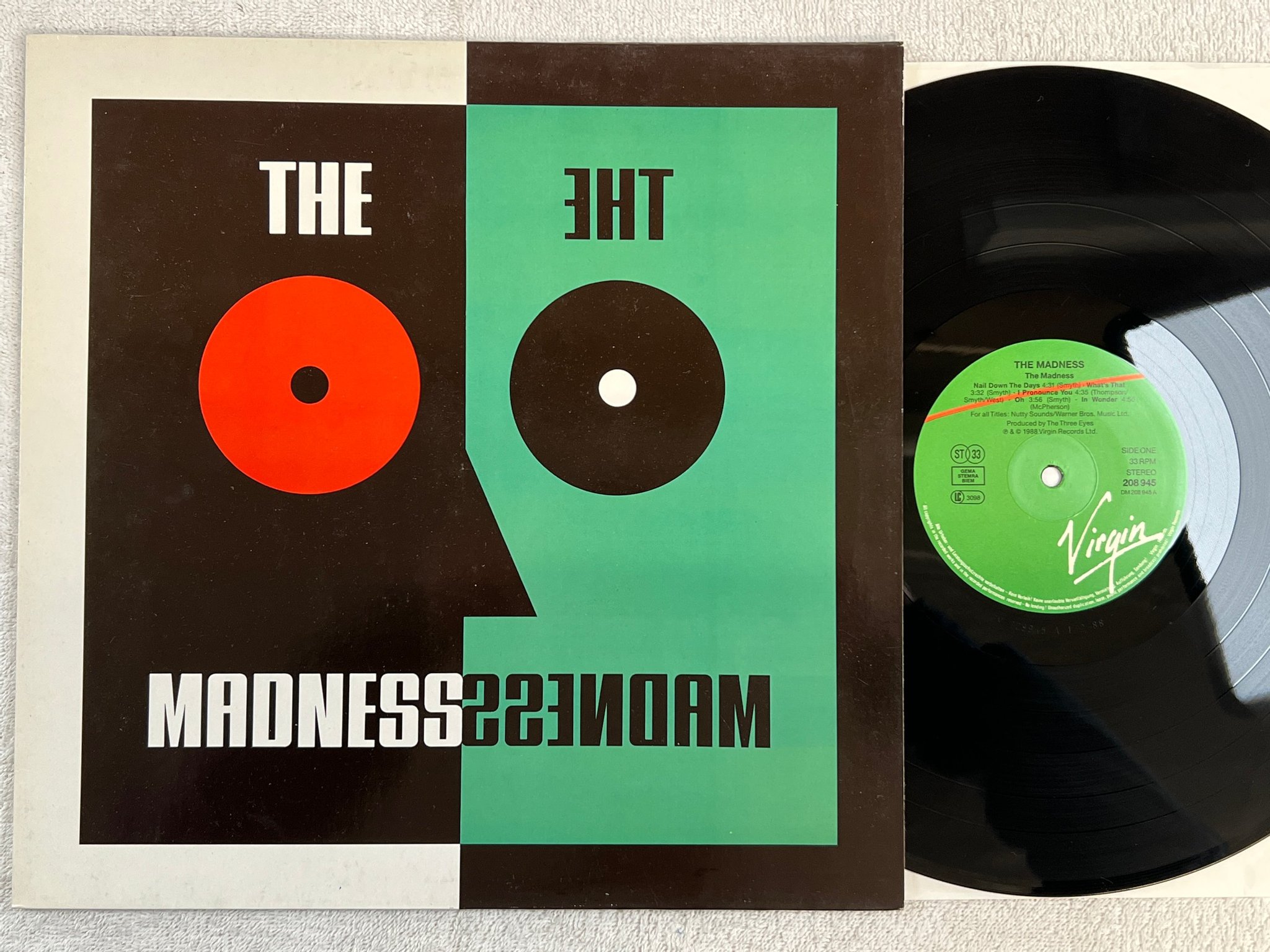 Omslagsbild för skivan THE MADNESS s/t LP -88 Ger VIRGIN 208945