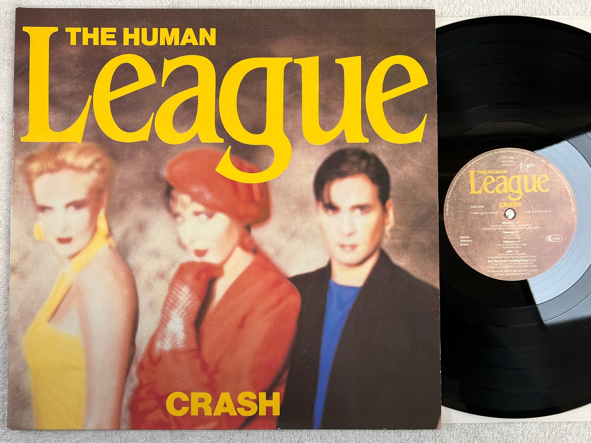 Omslagsbild för skivan THE HUMAN LEAGUE crash LP -86 VIRGIN 207589