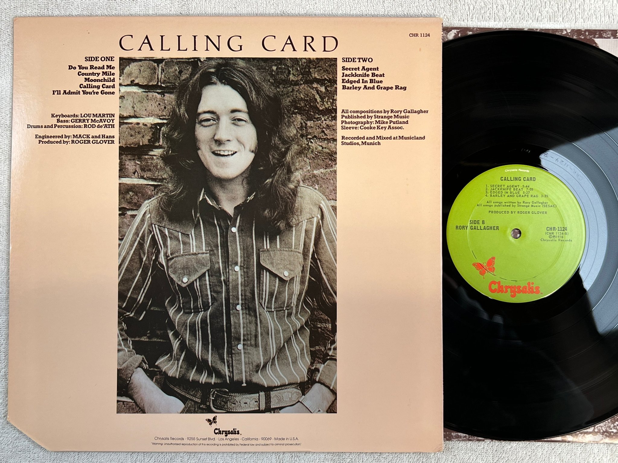 Omslagsbild för skivan RORY GALLAGHER calling card LP -76 US CHRYSALIS CHR 1124