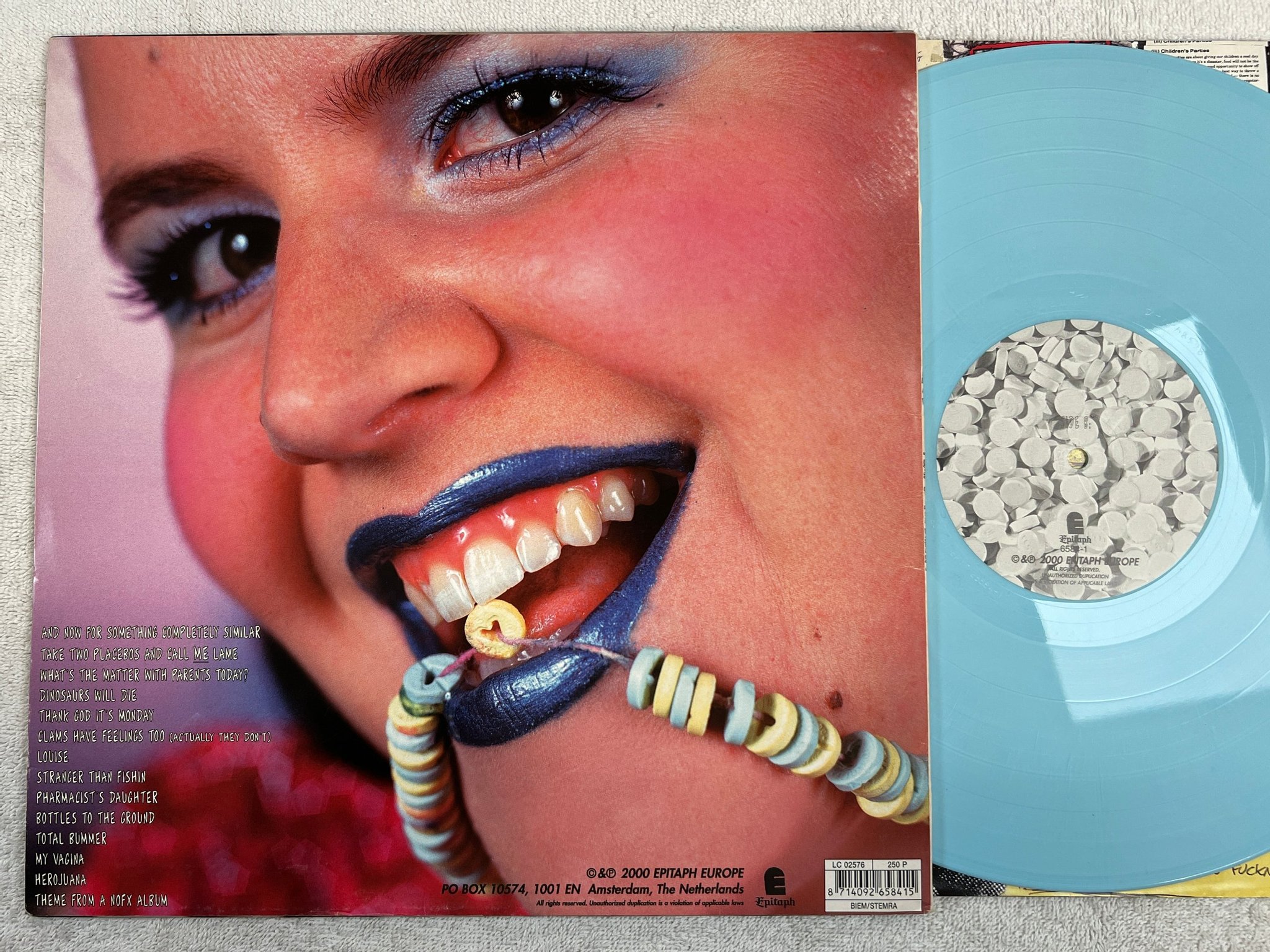 Omslagsbild för skivan NOFX Pump Up The Valuum LP 2000 EU EPIYAPH 6584-1 cyan vinyl ** punk rock **