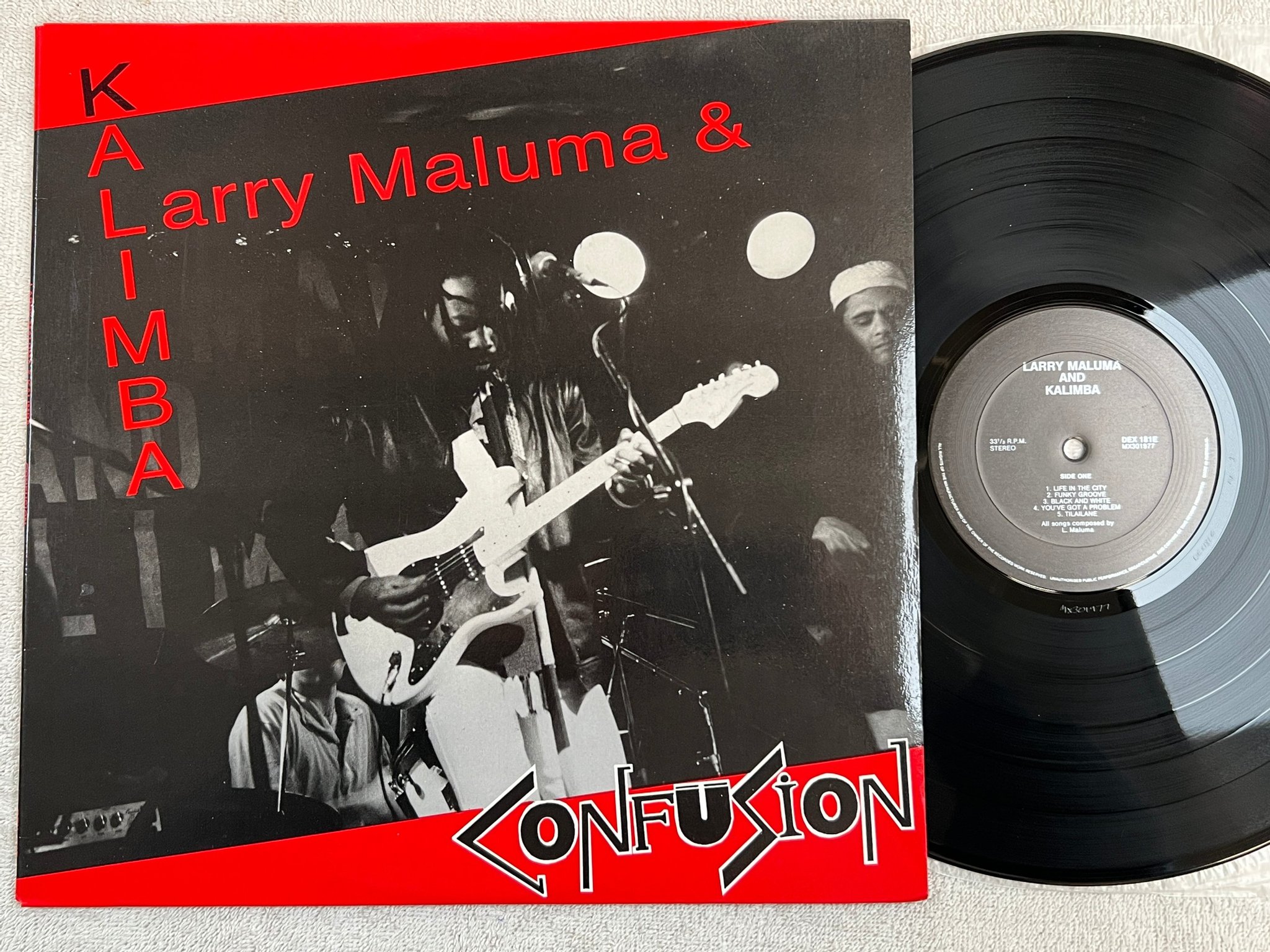 Omslagsbild för skivan LARRY MALUMA & KALIMBA confusion LP -87 Aussie DEX 181E reggae / folk