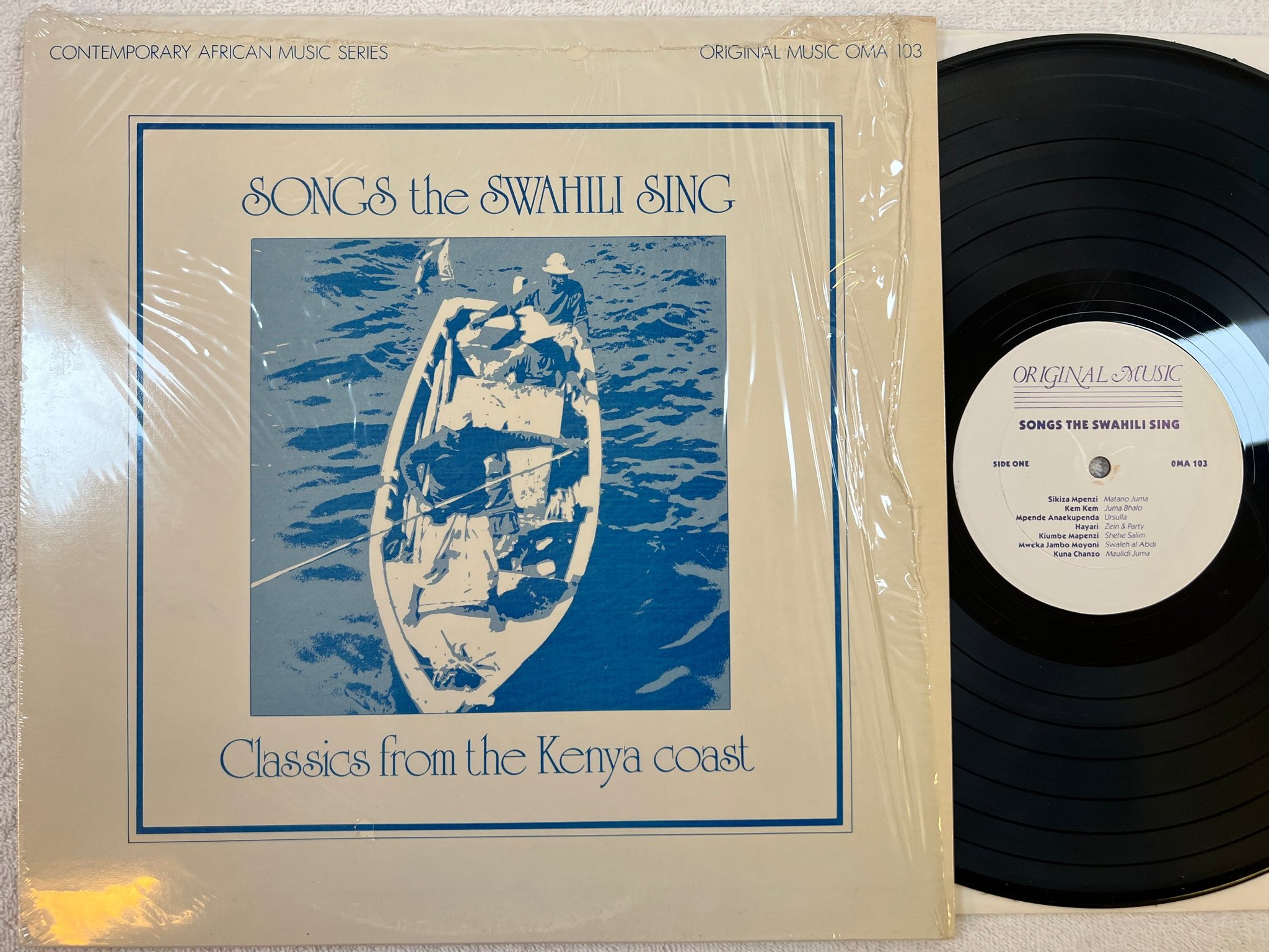 Omslagsbild för skivan V/A Songs The Swahili Sing LP -83 US ORIGINAL MUSIC OMA 103