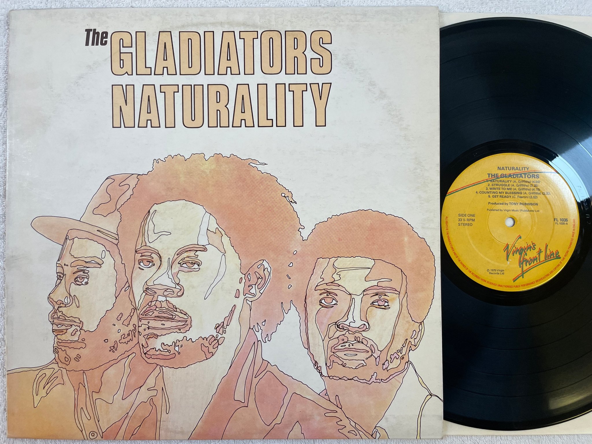 Omslagsbild för skivan THE GLADIATORS naturality LP -79 UK FRONT LINE FL 1035