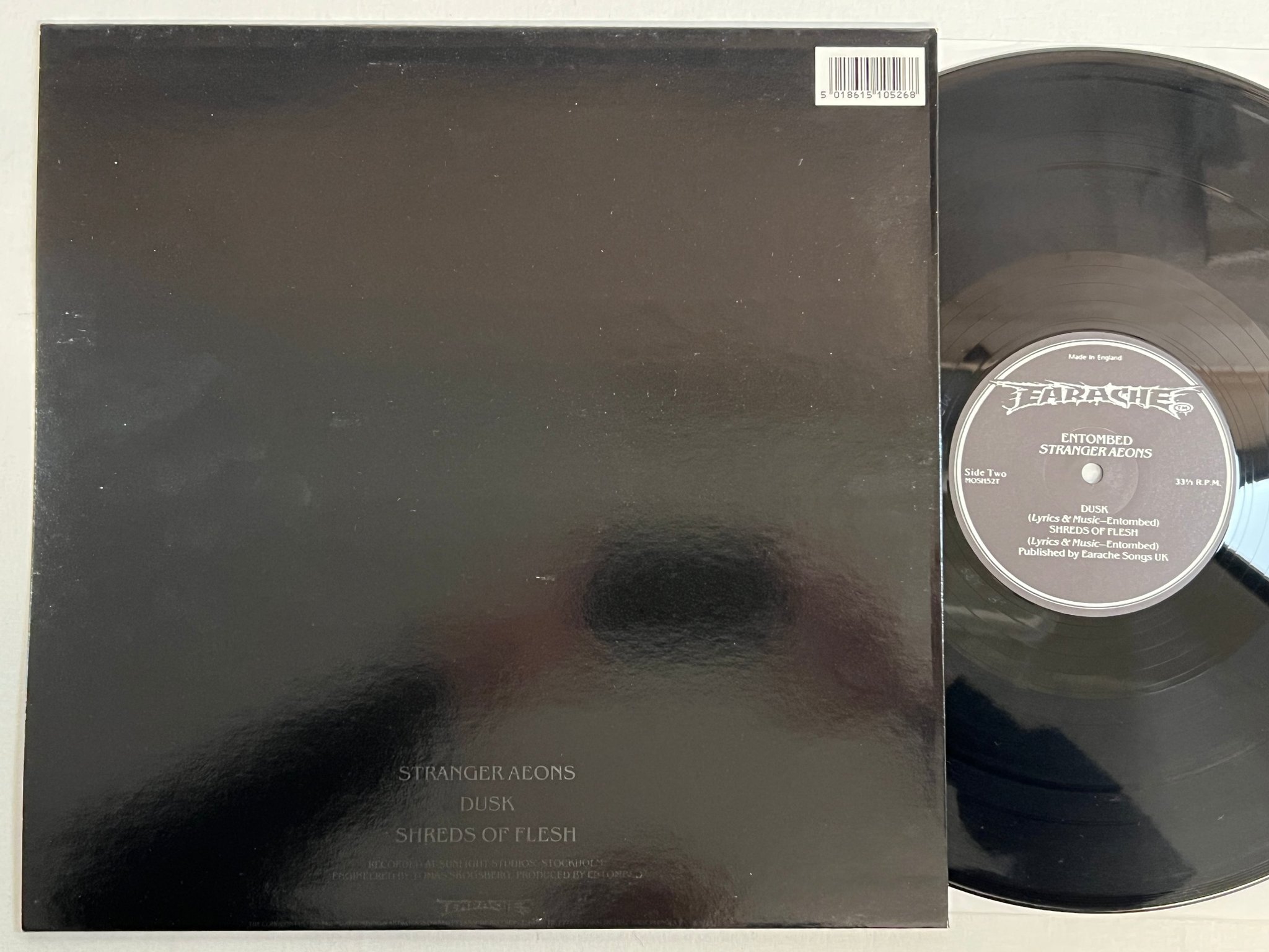 Omslagsbild för skivan ENTOMBED Stranger Aeons 12"ep -92 UK EARACHE MOSH 52T