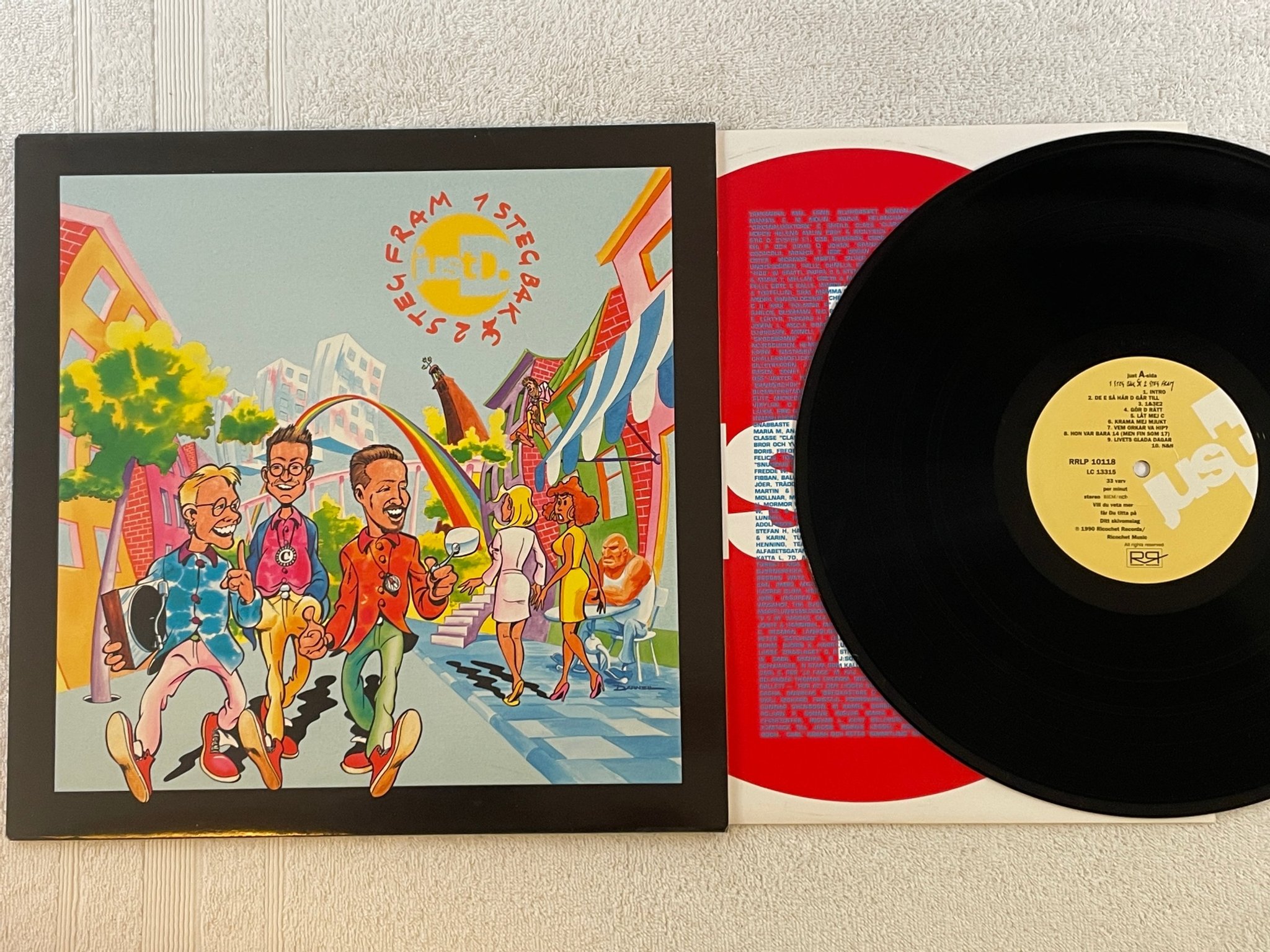 Omslagsbild för skivan JUST D 1 steg fram å 2 steg back LP -90 Swe RICHOCET RRLP 10118