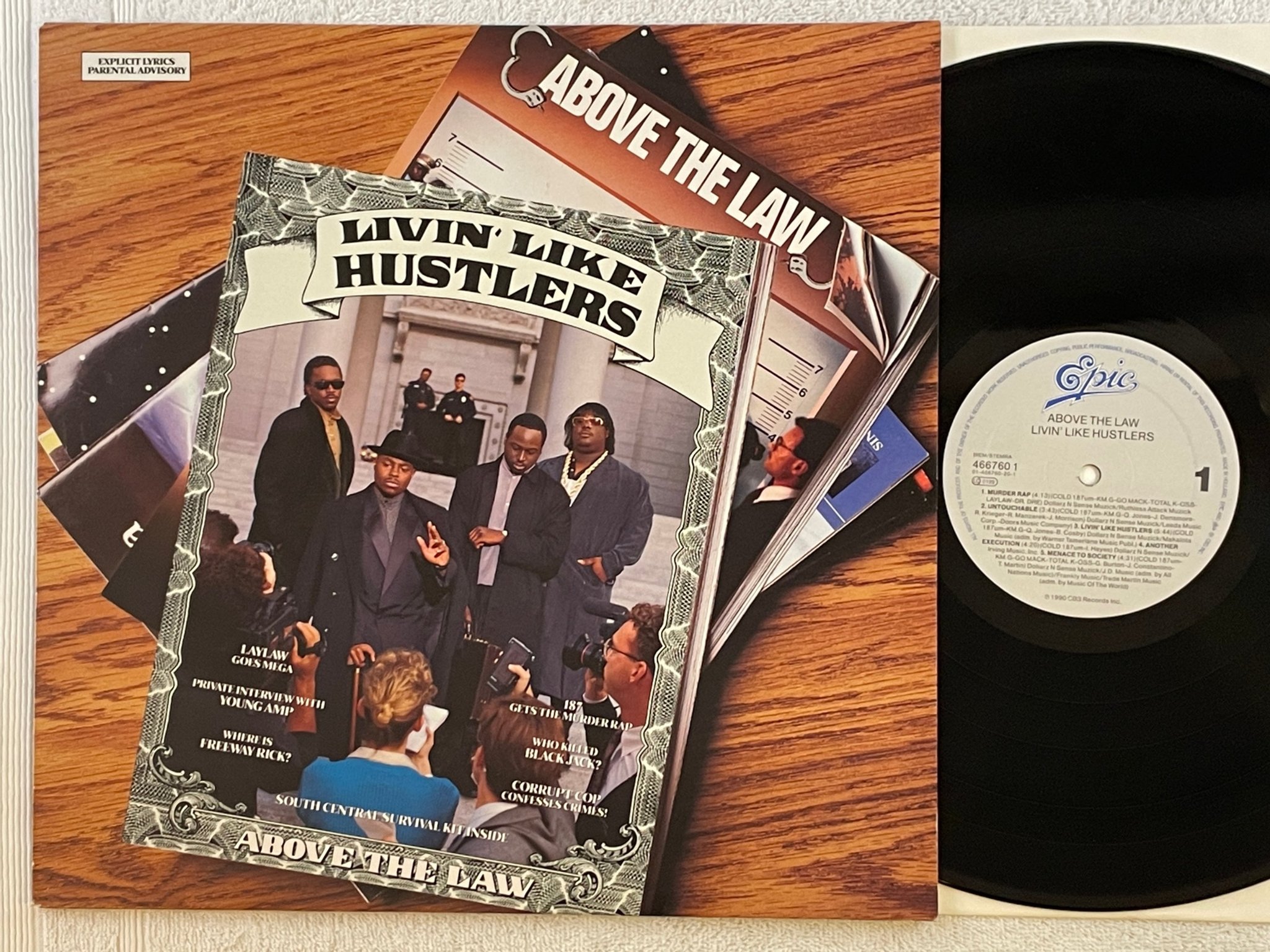 Omslagsbild för skivan ABOVE THE LAW Livin' Like Hustlers LP -90 Hol EPIC 466760 1