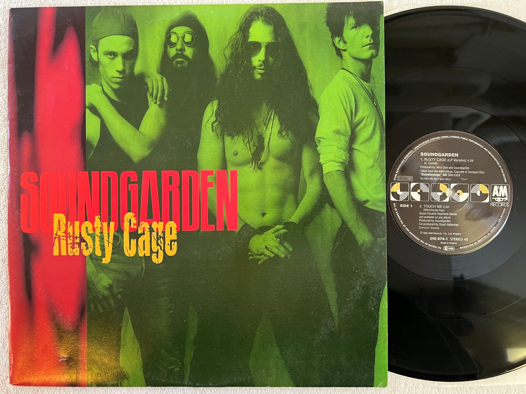 Omslagsbild för skivan SOUNDGARDEN rusty cage 12"single -92 Hol A&M 390874-1