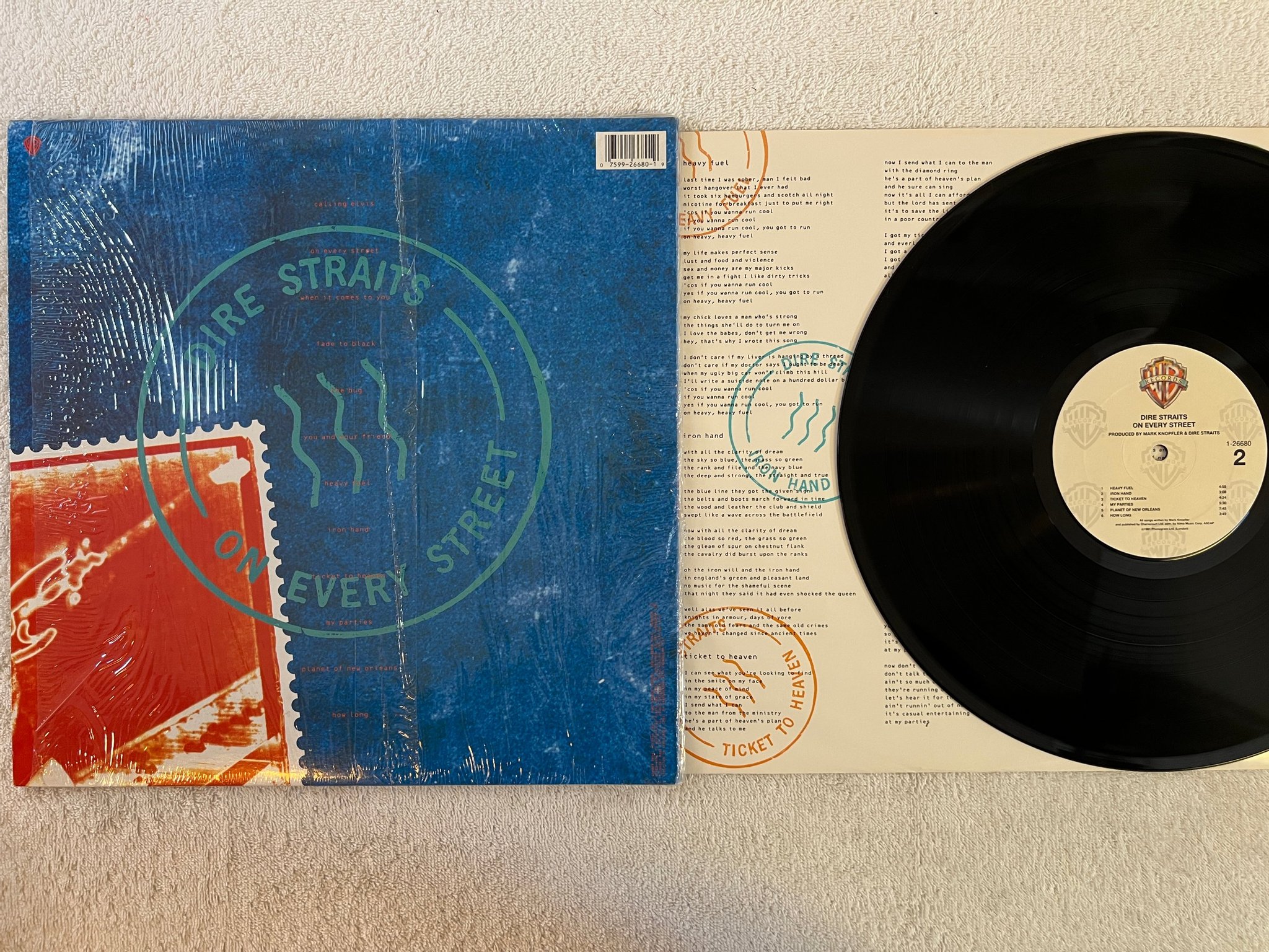 Omslagsbild för skivan DIRE STRAITS on every street LP -91 US WARNER BROS 1-26680