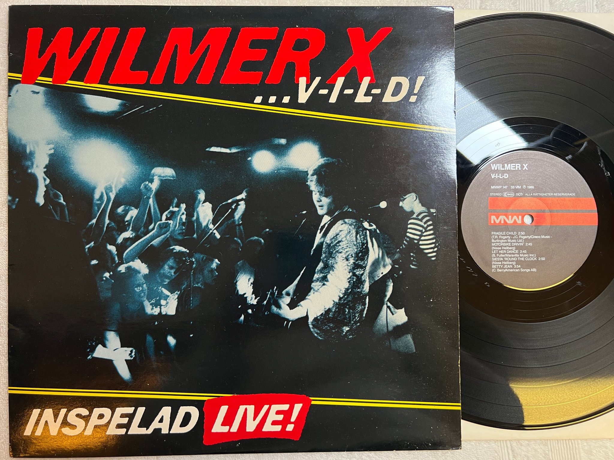 Omslagsbild för skivan WILMER X inspelad live LP -86 Swe MNW MWNWP-147