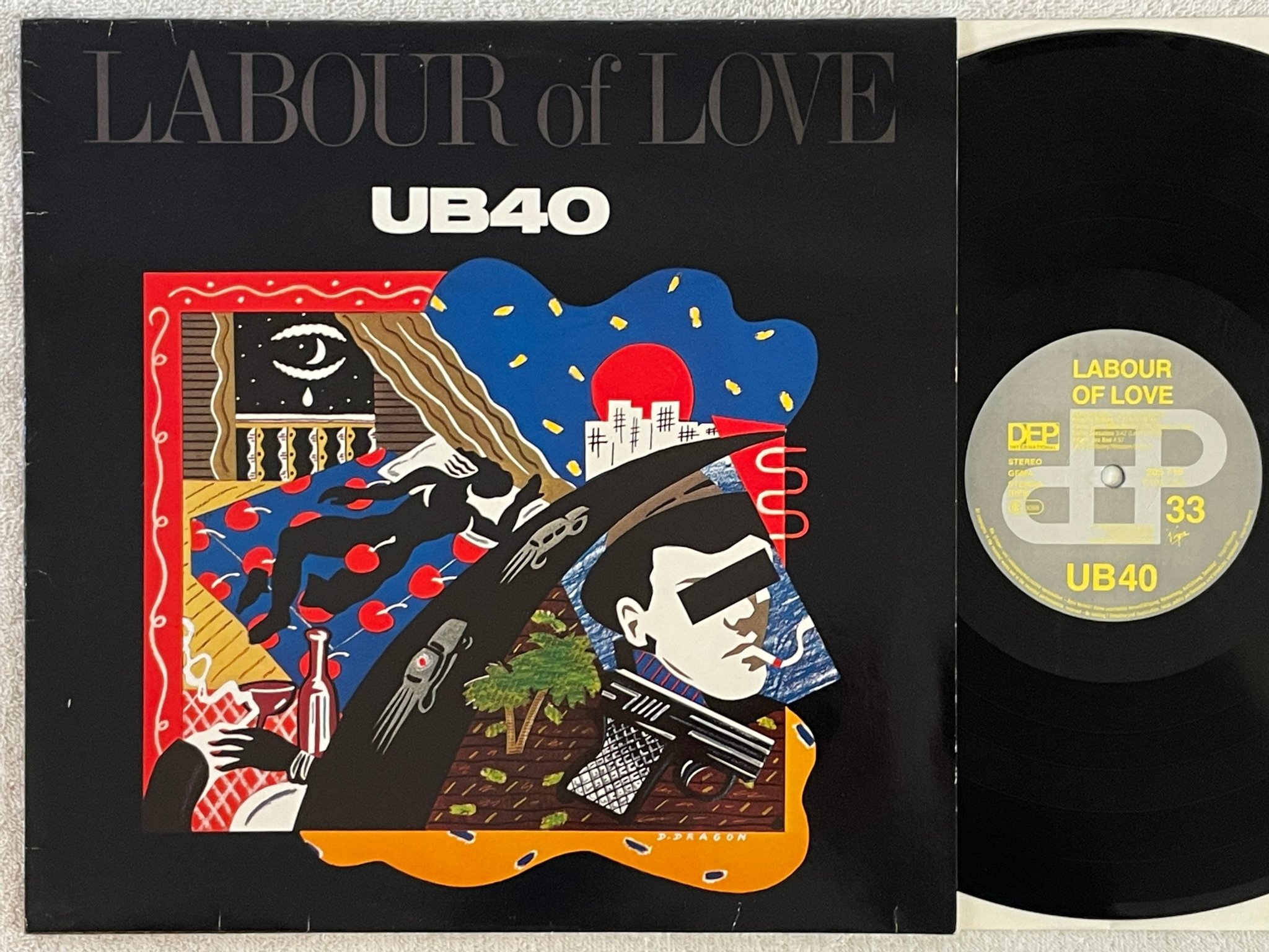 Omslagsbild för skivan UB 40 labour of love LP -83 Hol DEP 205716 "red red wine"