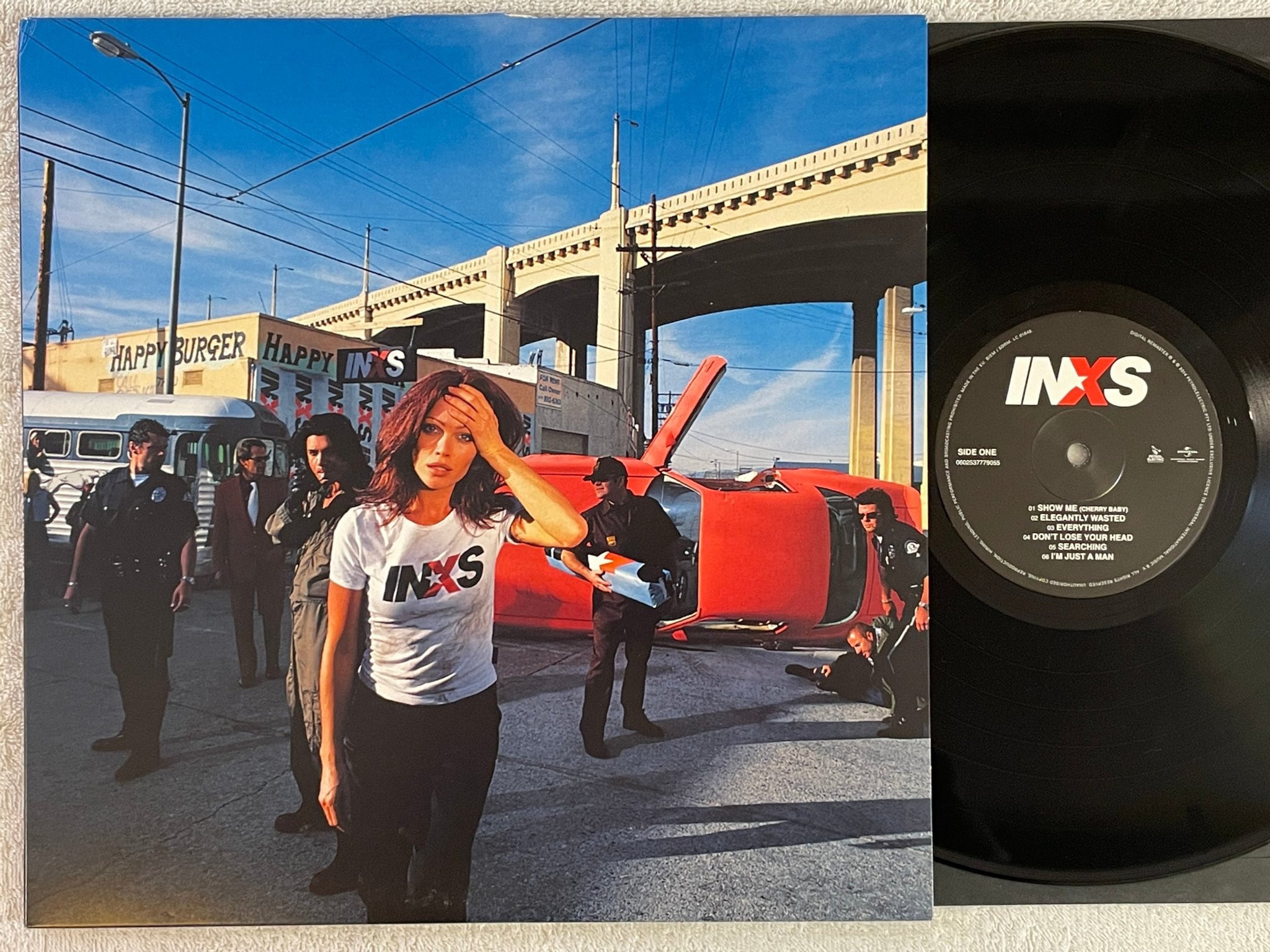 Omslagsbild för skivan INXS elegantly wasted LP 2014 UNIVERSAL 0602537779055 alternative rock