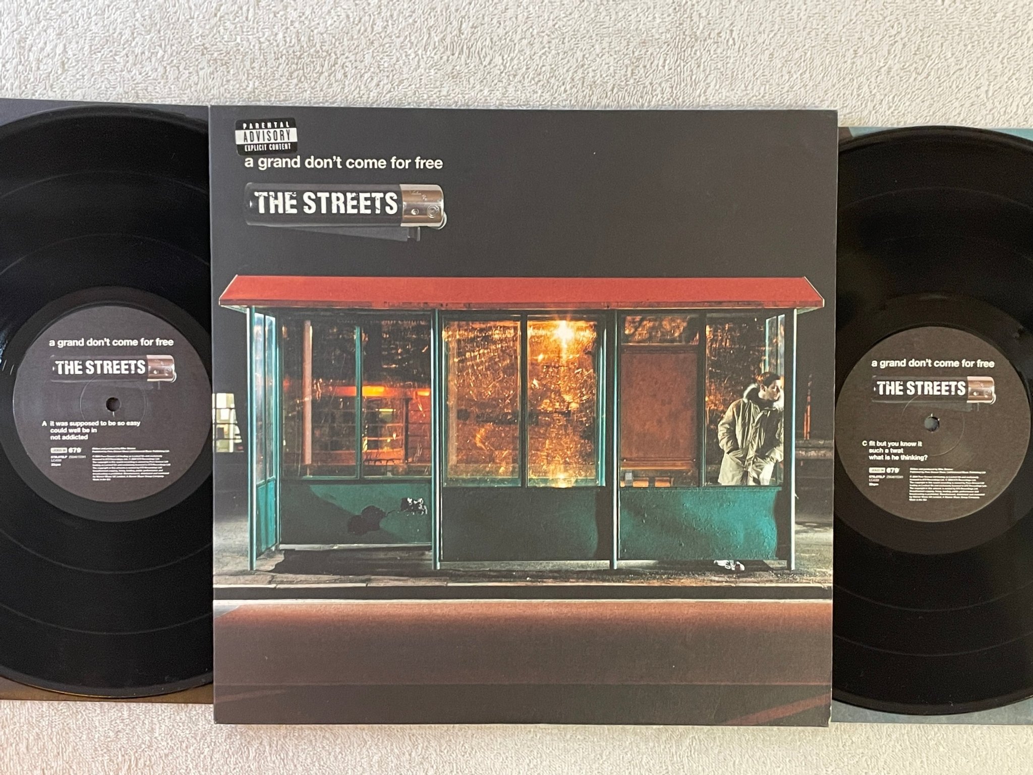 Omslagsbild för skivan THE STREETS A Grand Don't Come For Free 2xLP 2004 679L070LP breaks 