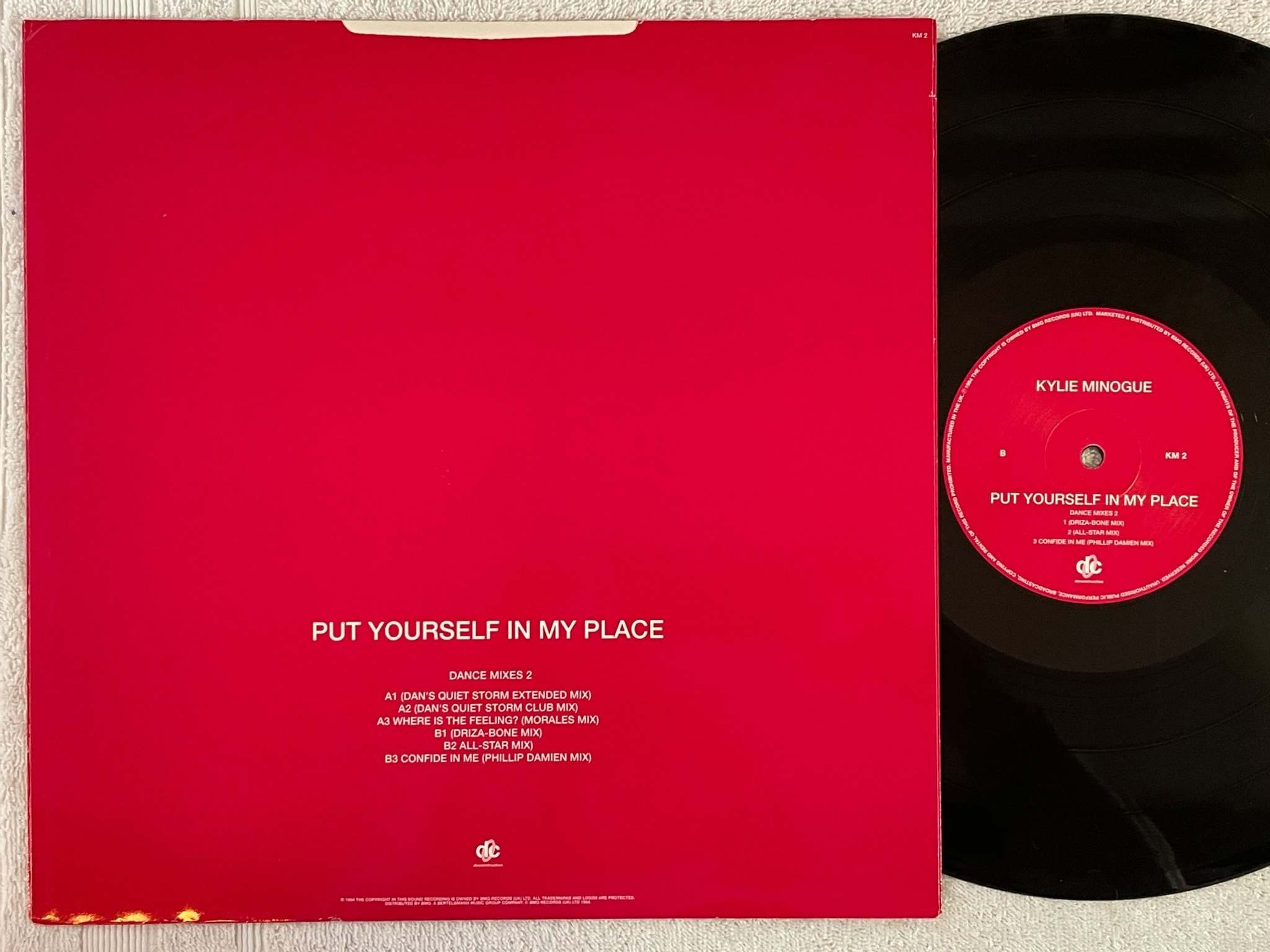 Omslagsbild för skivan KYLIE MINOGUE Put Yourself In My Place (Dance Mixes 2) 12" UK -94 DECONSTRUCTION