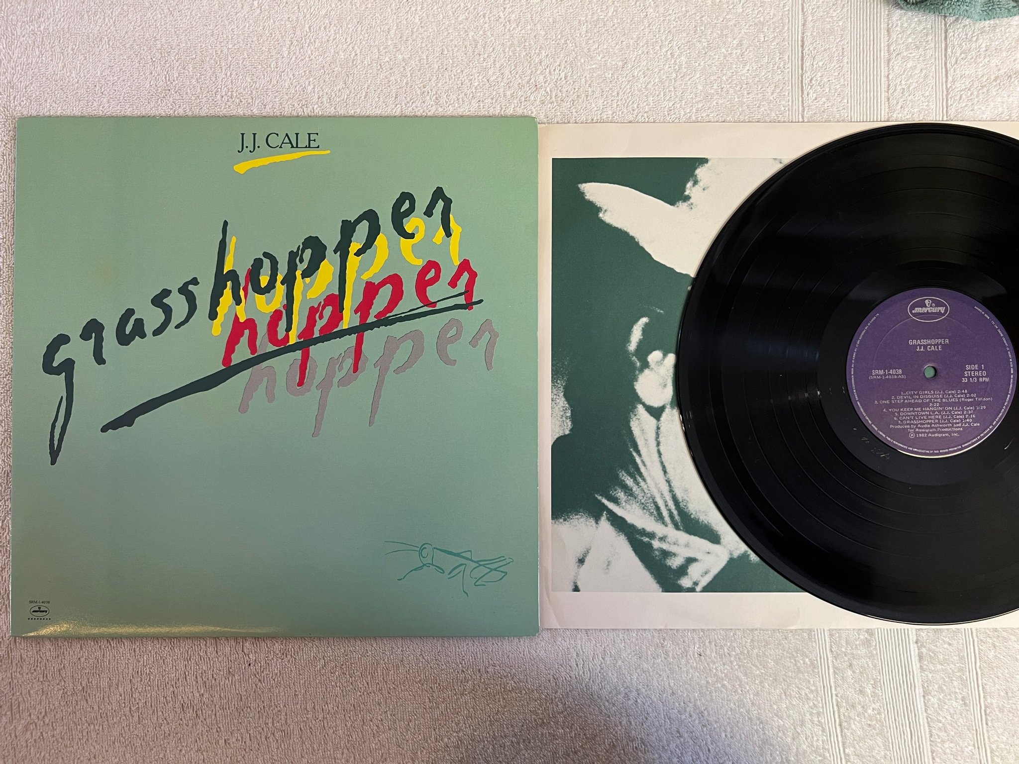 Omslagsbild för skivan JJ CALE grasshopper LP -82 Can MERCURY SRM-1-4038