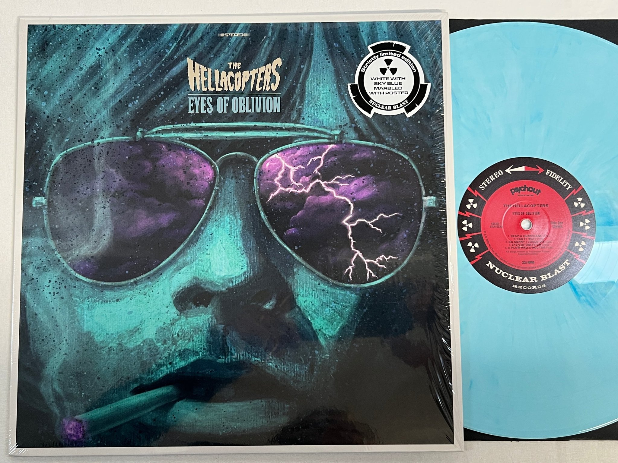 Omslagsbild för skivan THE HELLACOPTERS Eyes Of Oblivion LP 2022 White / Sky Blue Marbled