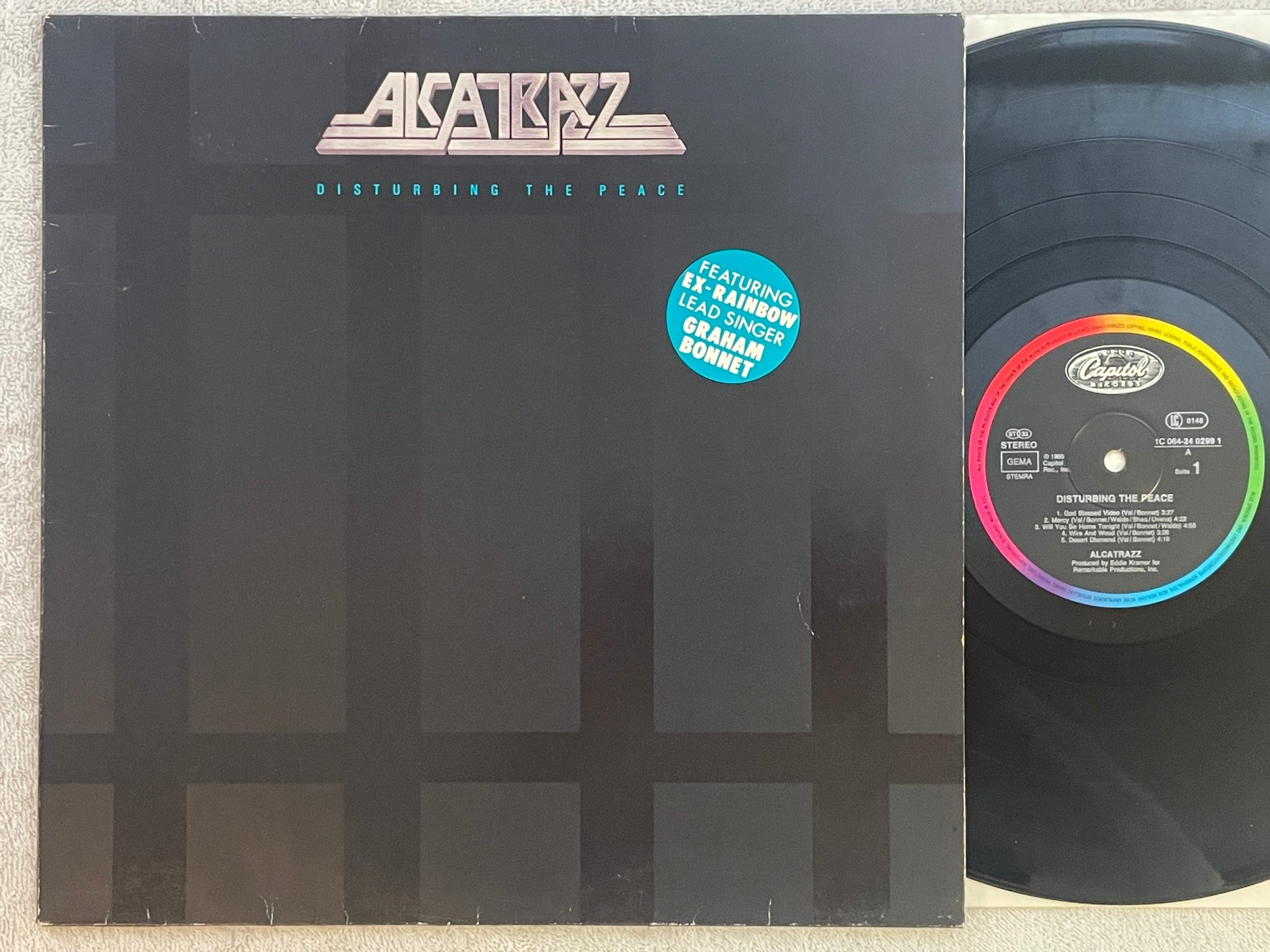 Omslagsbild för skivan ALCATRAZZ Disturbing The Peace LP -85 Ger CAPITOL 1C 064-2402991