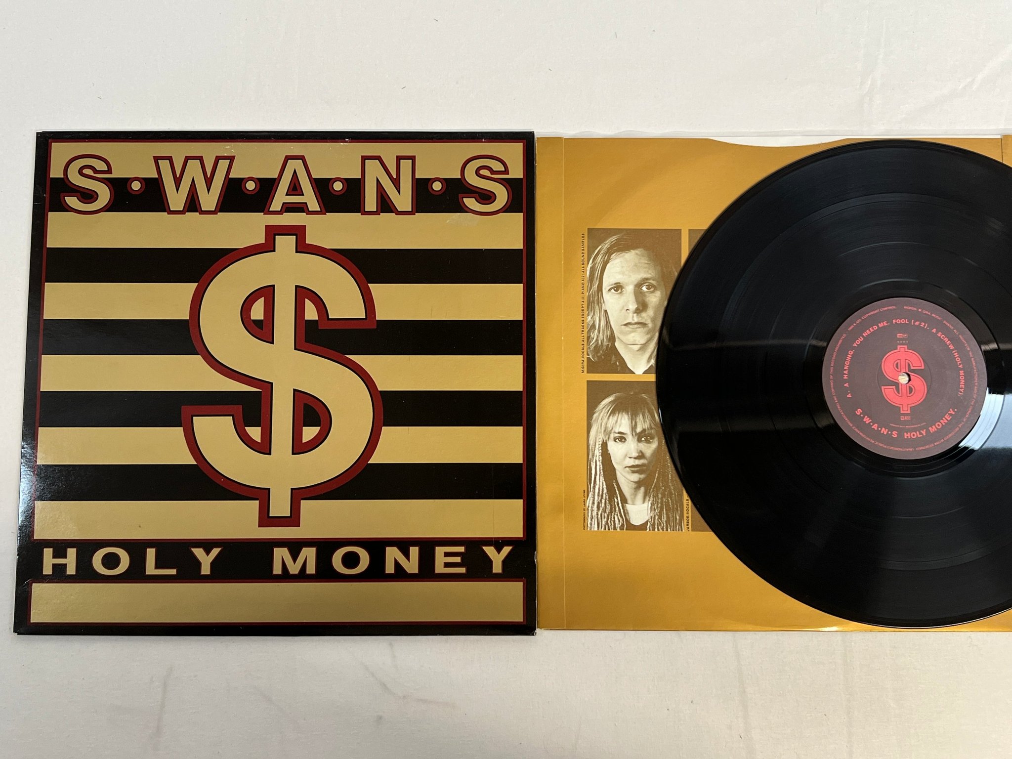Omslagsbild för skivan SWANS Holy Money LP mini-album -86 UK k.422 KCC 3 INDUSTRIAL ROCK