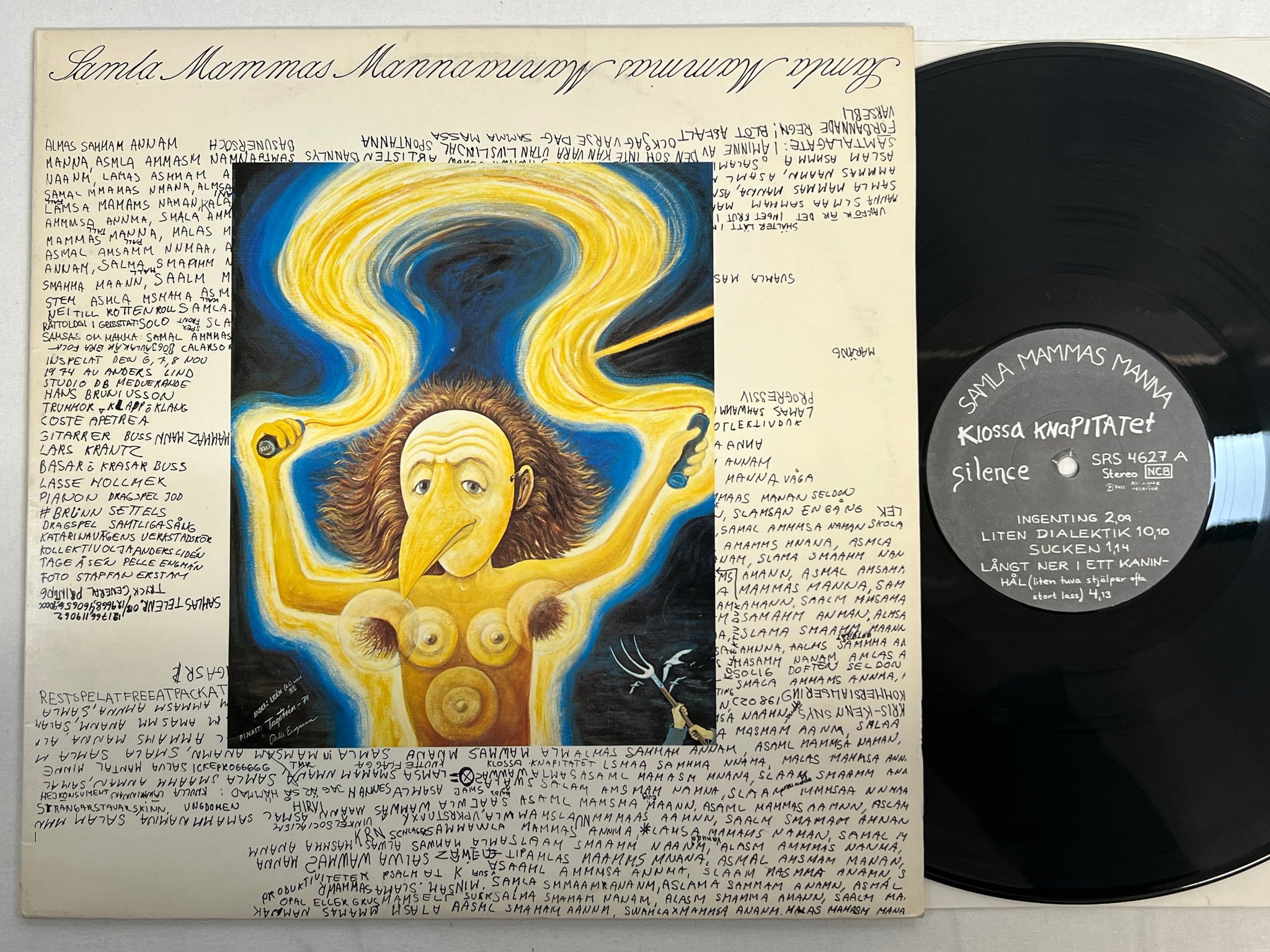 Omslagsbild för skivan SAMLA MAMMAS MANNA klossa knapitalet LP -74 Swe SILENCE SRS 4627