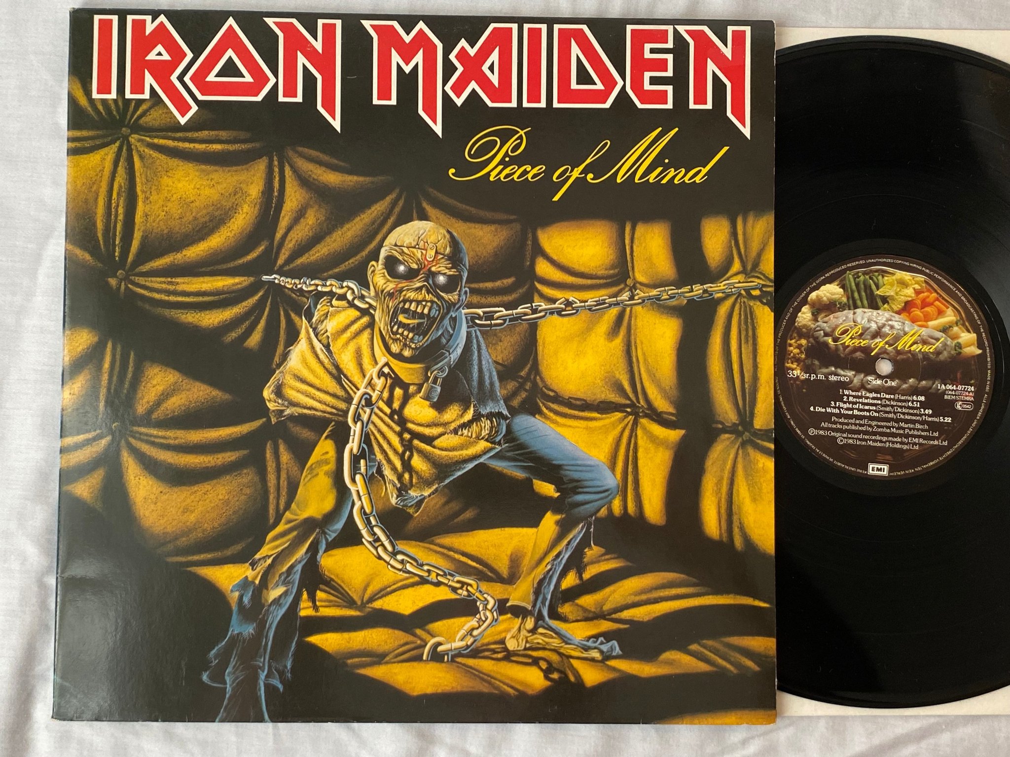 Omslagsbild för skivan IRON MAIDEN piece of mind LP -83 Ger EMI 1A 064-07724