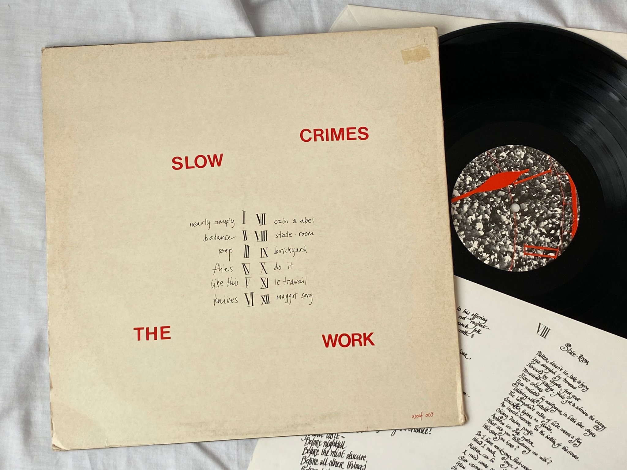 Omslagsbild för skivan THE WORK slow crimes LP -82 UK WOOF 003 nimbus cut POST PUNK 