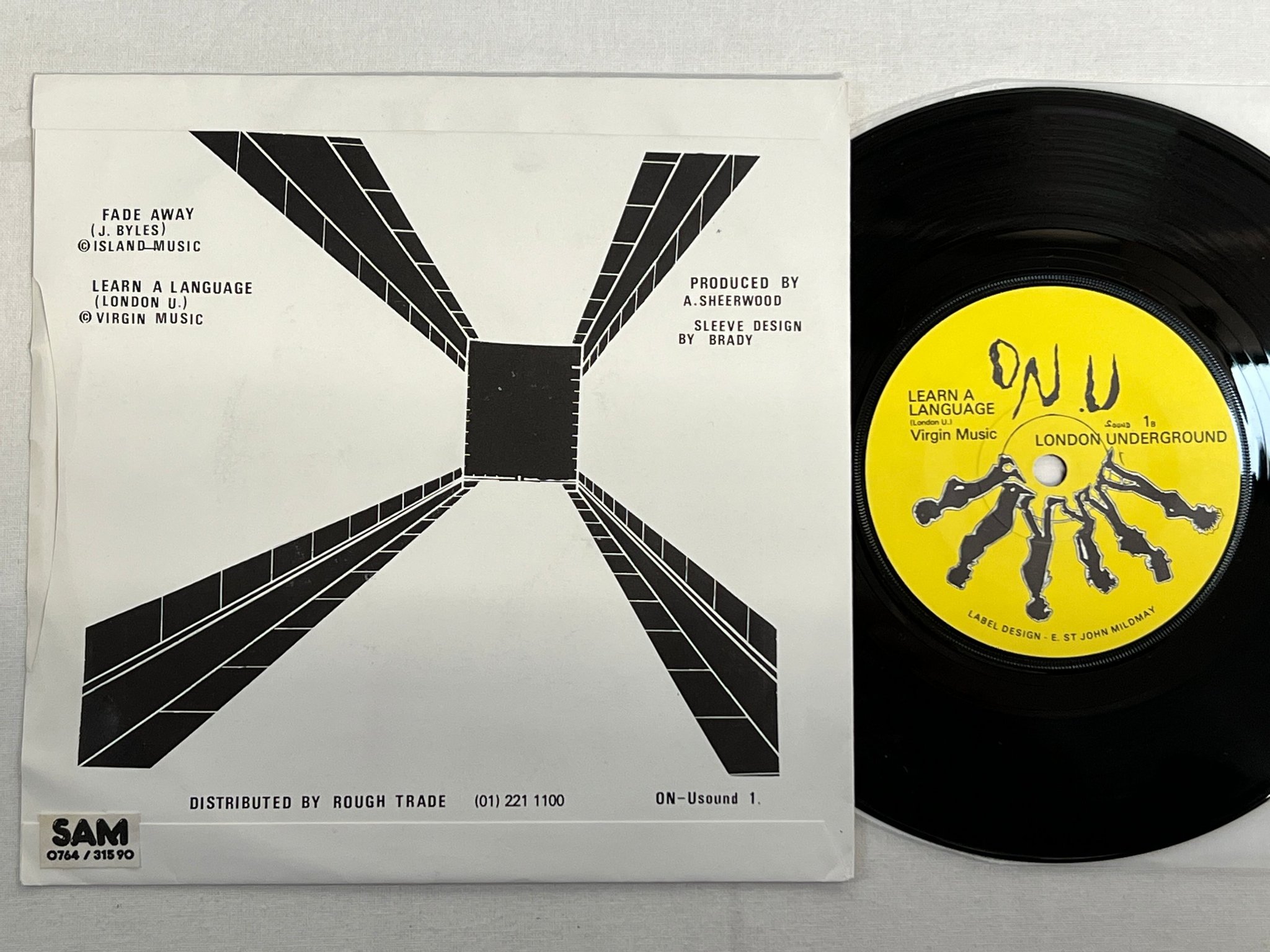 Omslagsbild för skivan NEW AGE STEPPERS Fade Away / LONDON UNDERGROUND Learn A Language 7" split UK 