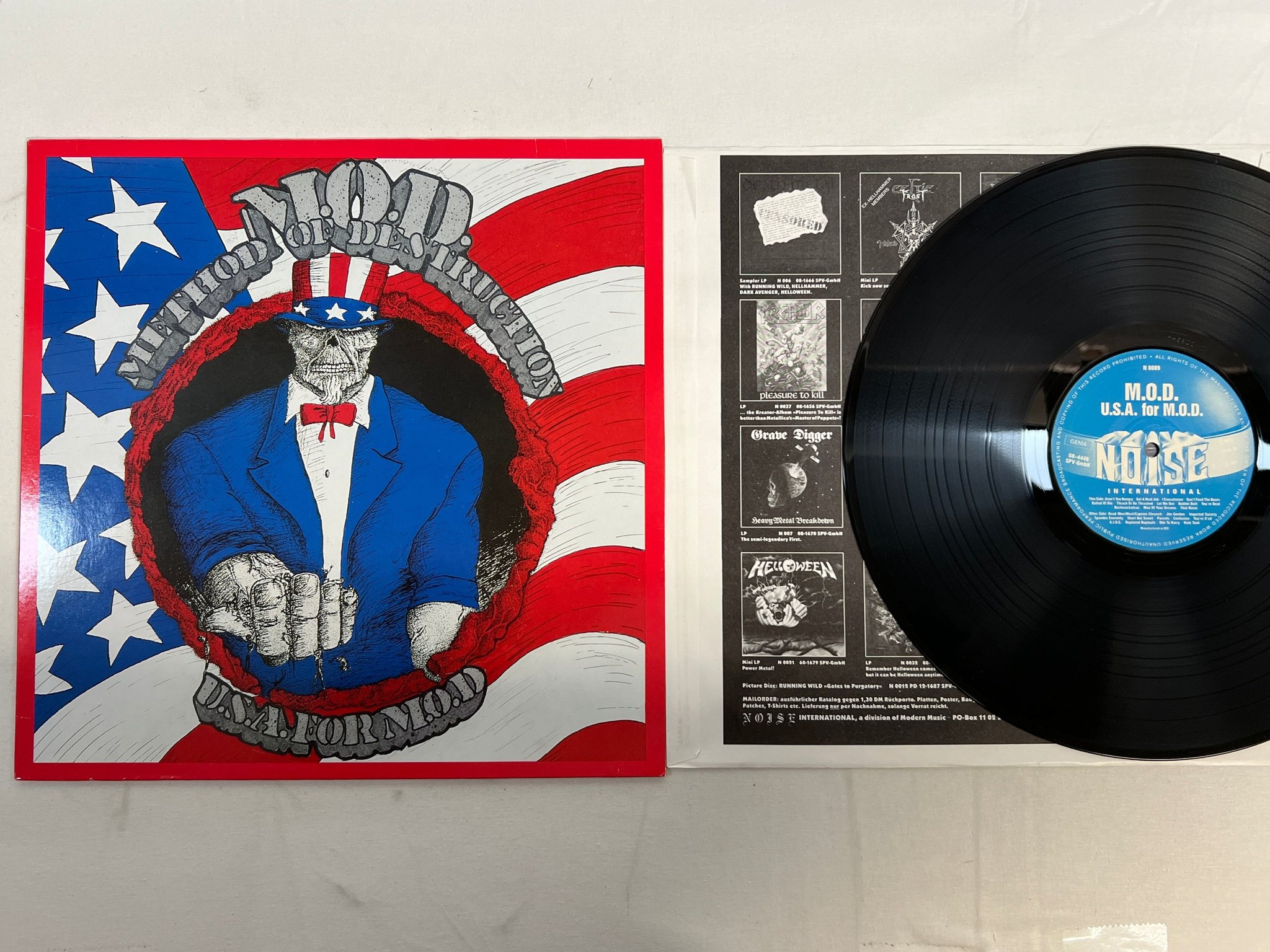 Omslagsbild för skivan M.O.D.  U.S.A. For M.O.D. LP -87 Ger NOISE N 0089 trash