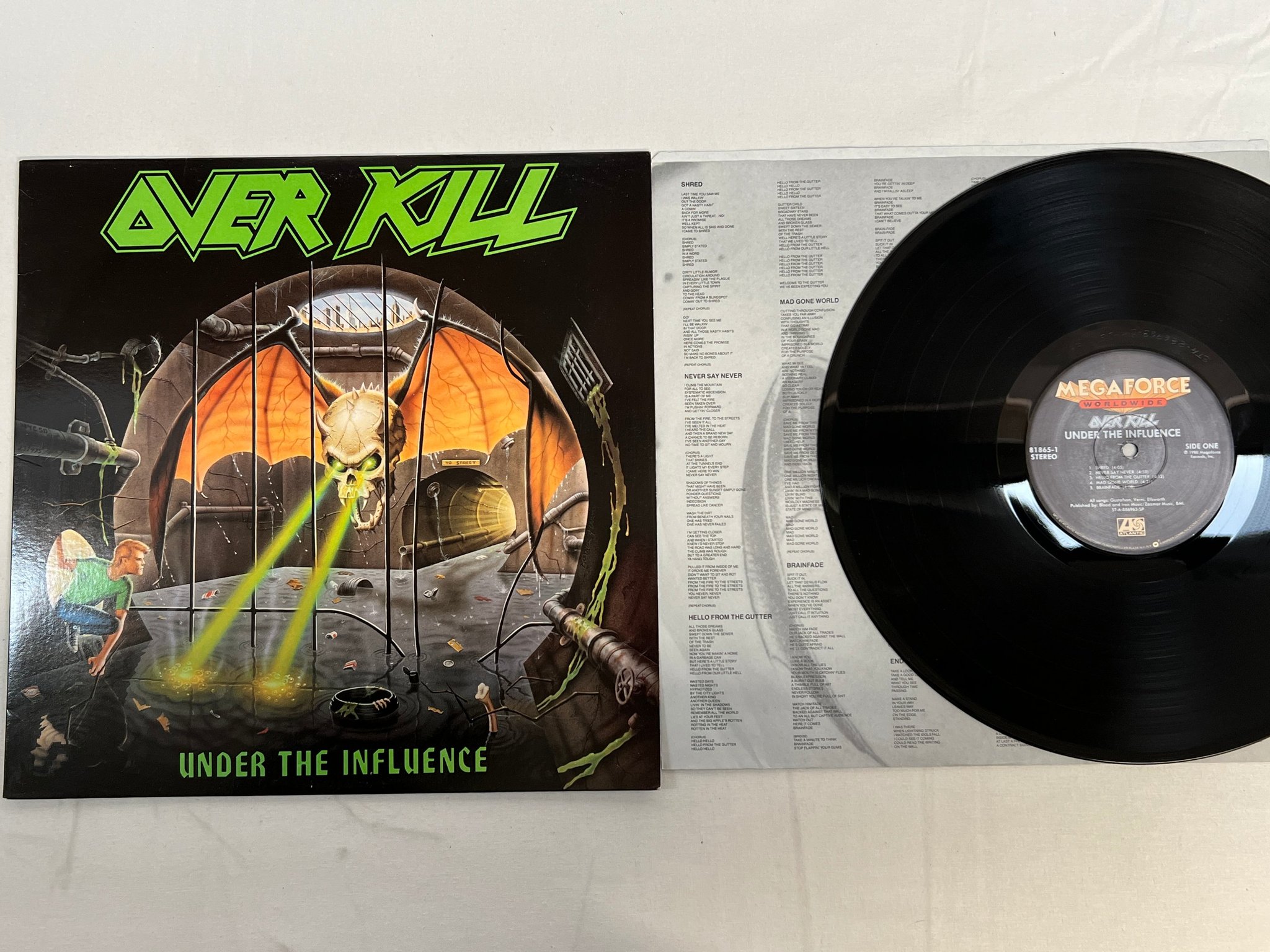 Omslagsbild för skivan OVERKILL  under the influence LP -88 US megaforce 81865-1 HEAVY METAL