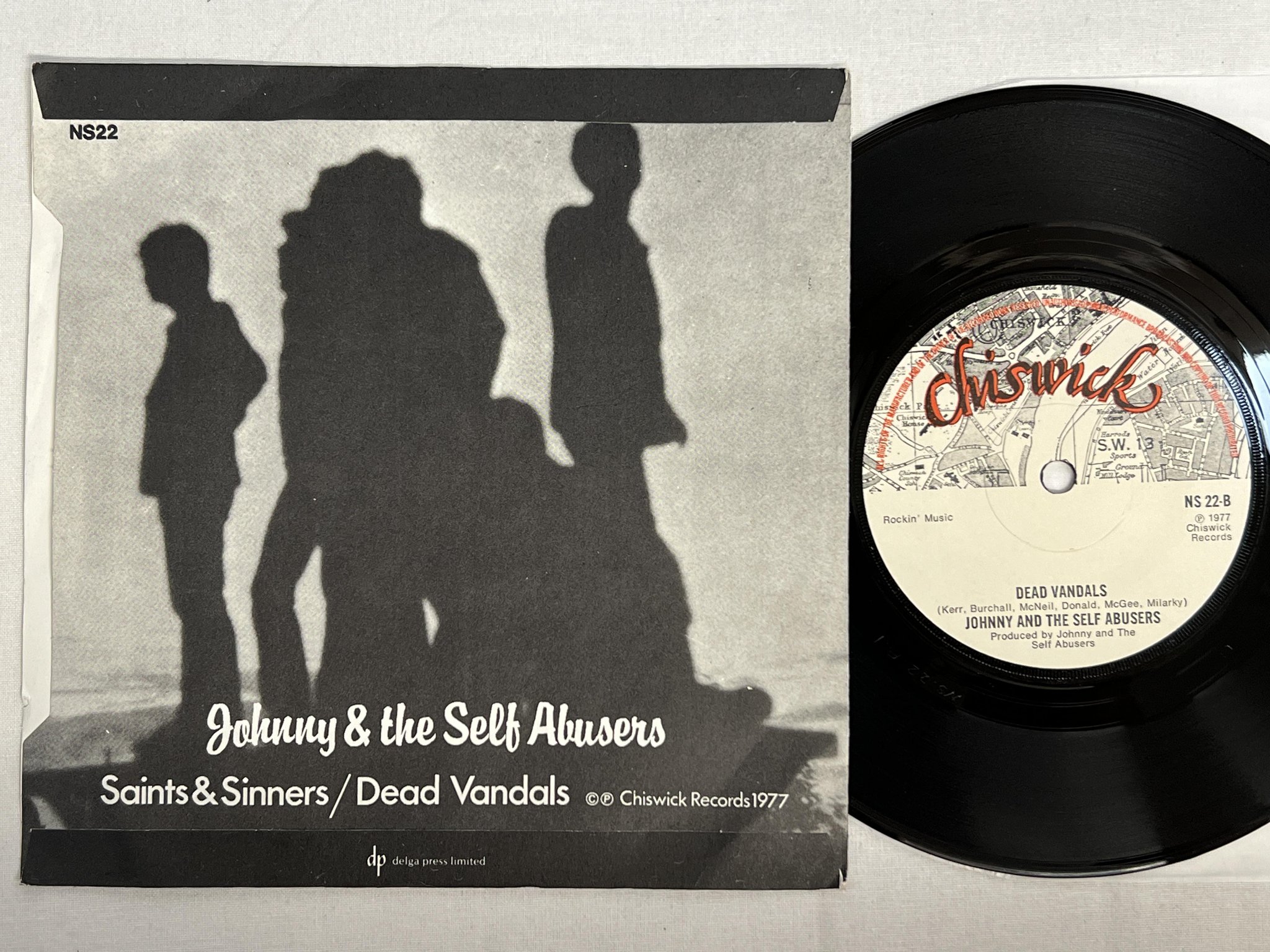 Omslagsbild för skivan JOHNNY AND THE SELF ABUSERS saints and sinners  7" -77 CHISWICK NS-22