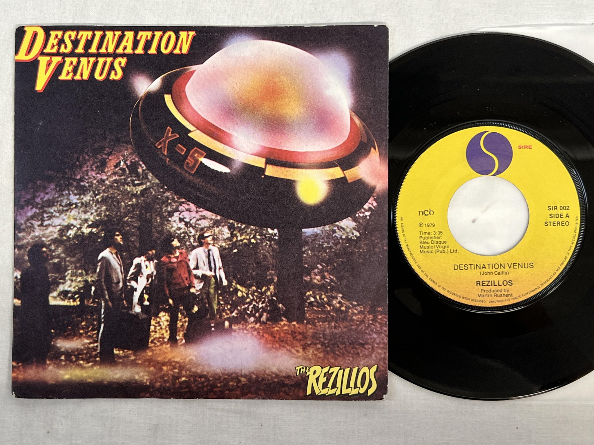 Omslagsbild för skivan THE REZILLOS destination venus 7" -79 ncb SIRE SIR-002 punk