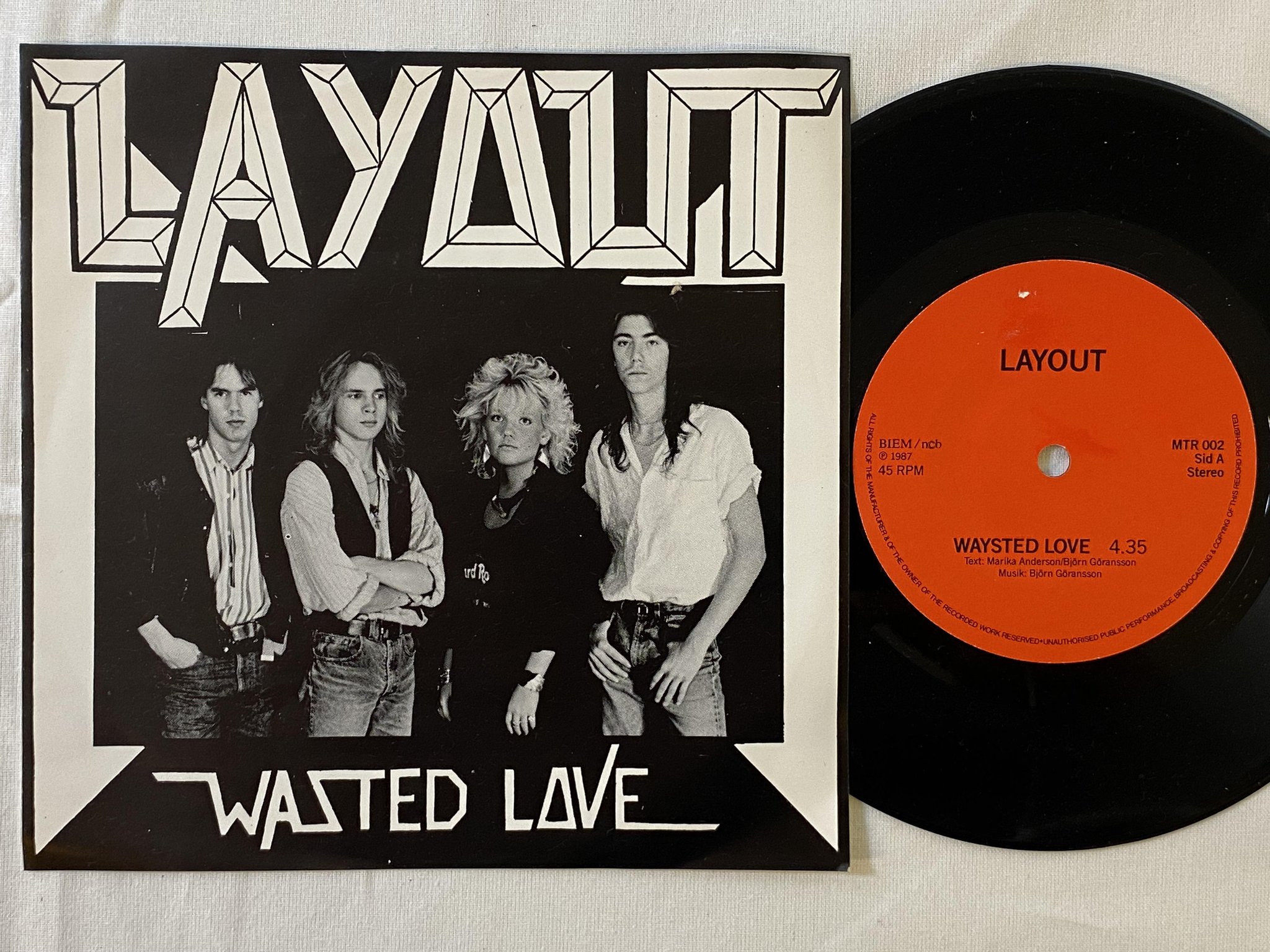 Omslagsbild för skivan LAYOUT wasted love 7"single -87 Swe private press ** MEGA RARE METAL **