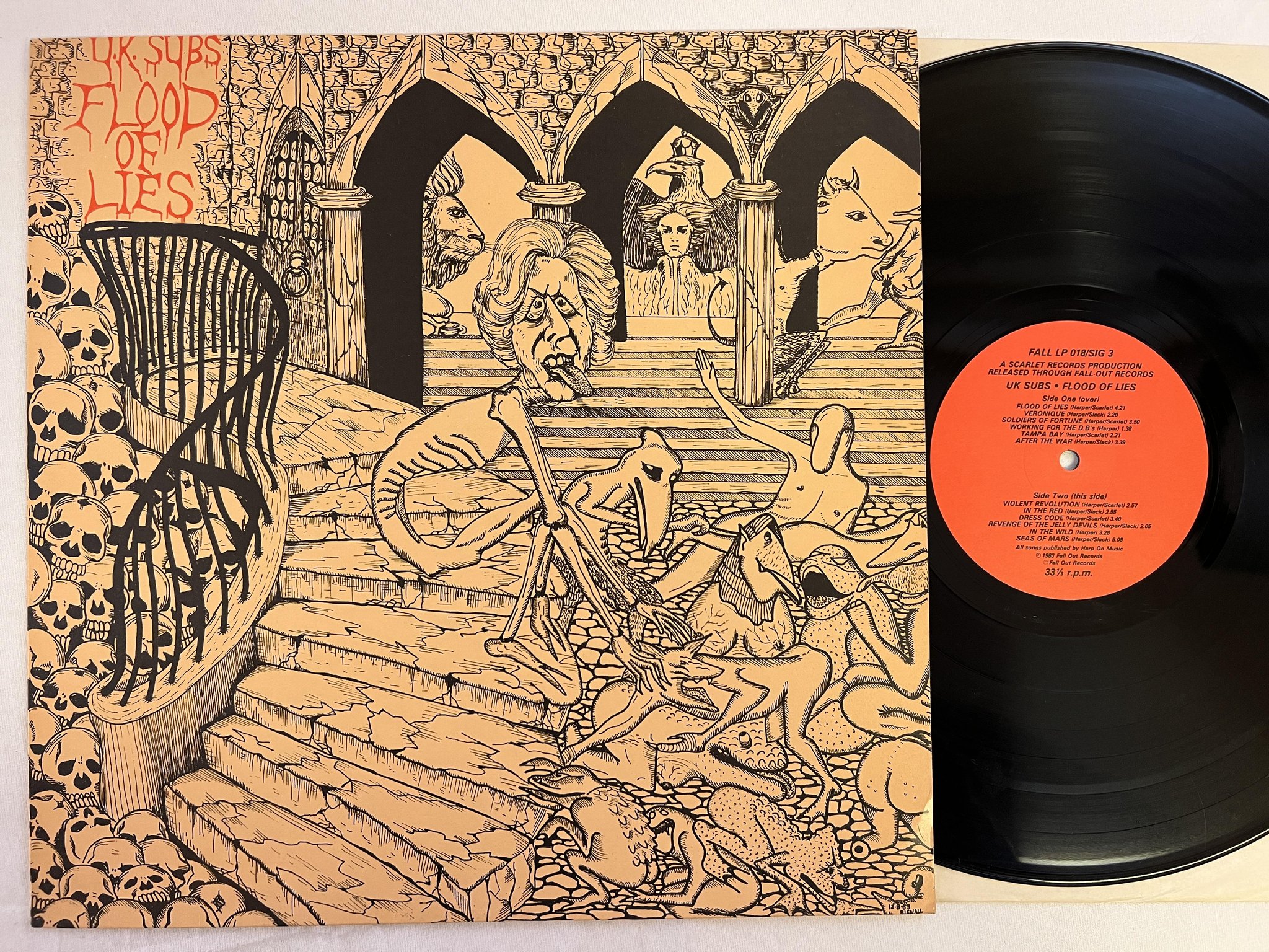 Omslagsbild för skivan U.K. SUBS Flood Of Lies LP -83 UK FALLOUT FALL LP 018