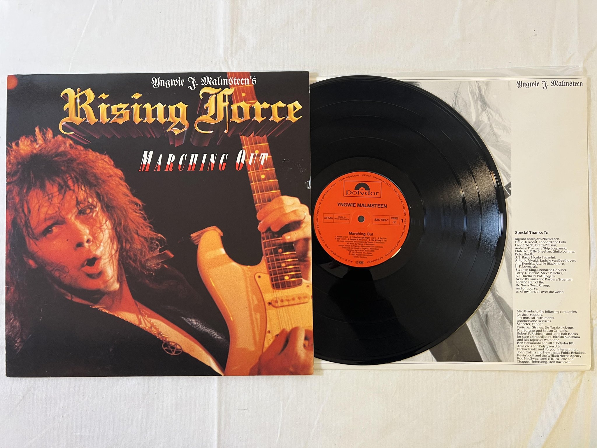 Omslagsbild för skivan YNGWIE J MALMSTEEN marching out LP -85 Ger POLYDOR 825733-1