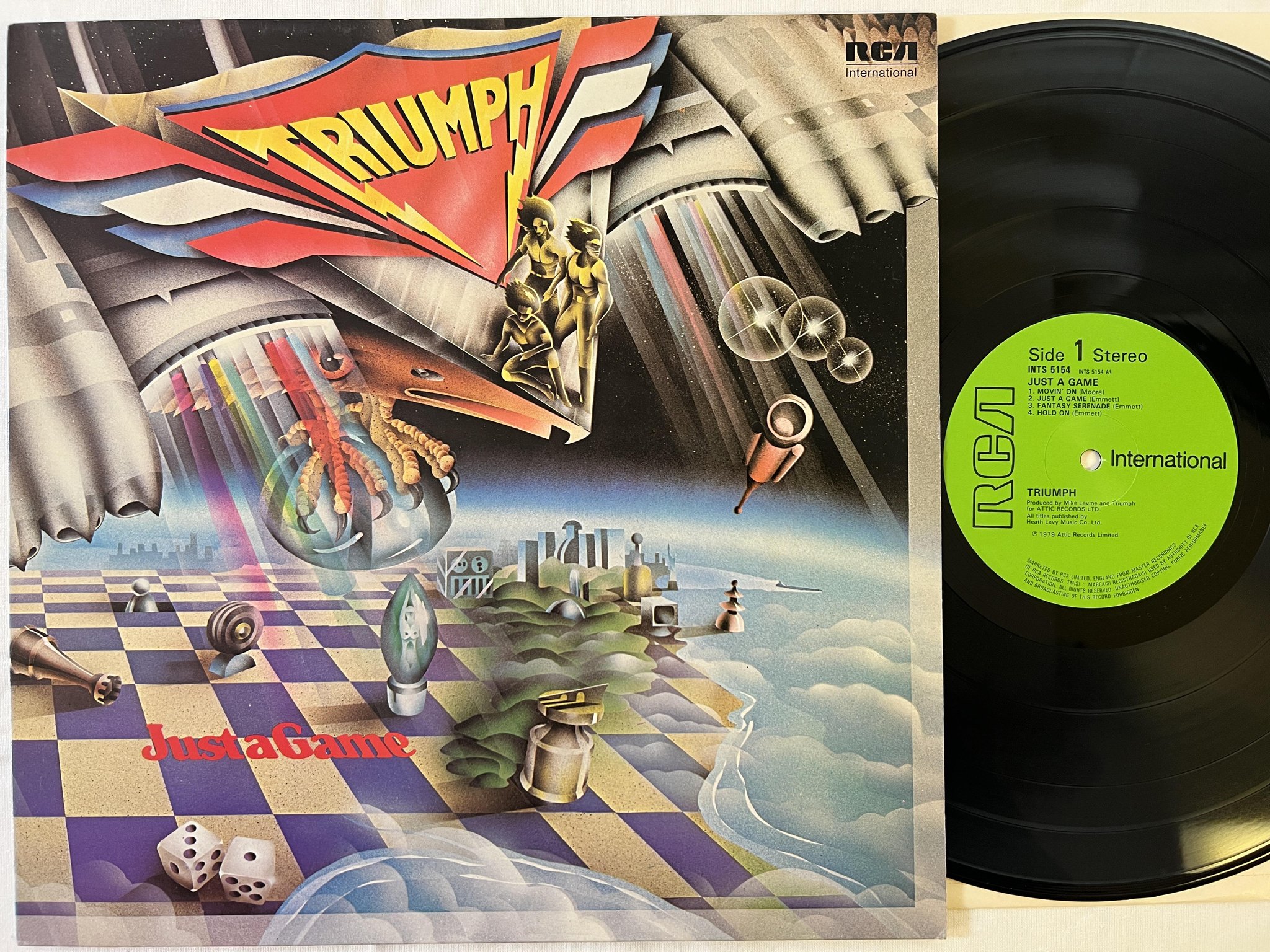 Omslagsbild för skivan TRIUMPH just a game LP -81 UK RCA INTERNATIONAL INTS 5154