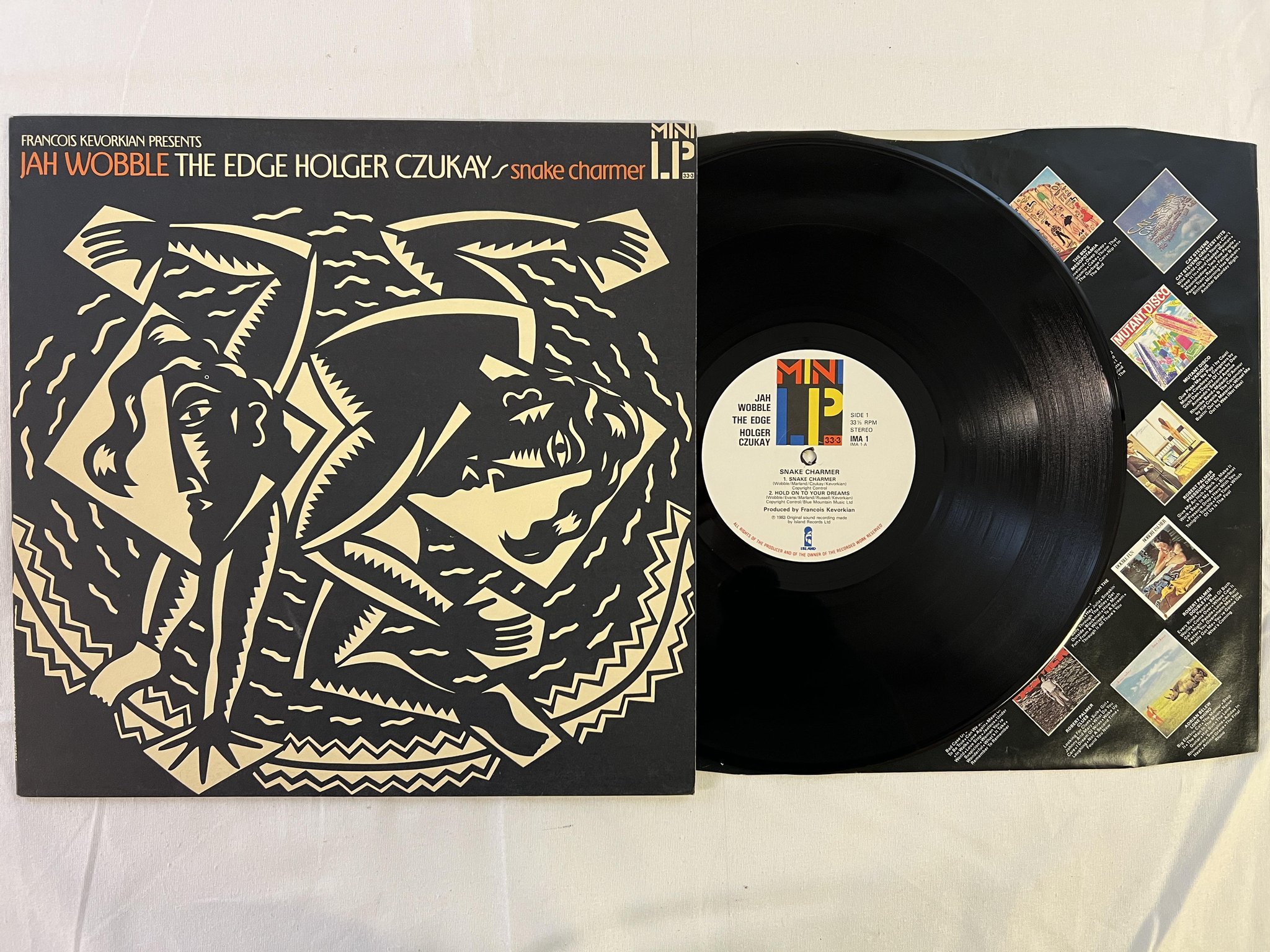 Omslagsbild för skivan JAH WOBBLE snake charmer MINI-LP -83 UK ISLAND ima-1 leftfield 