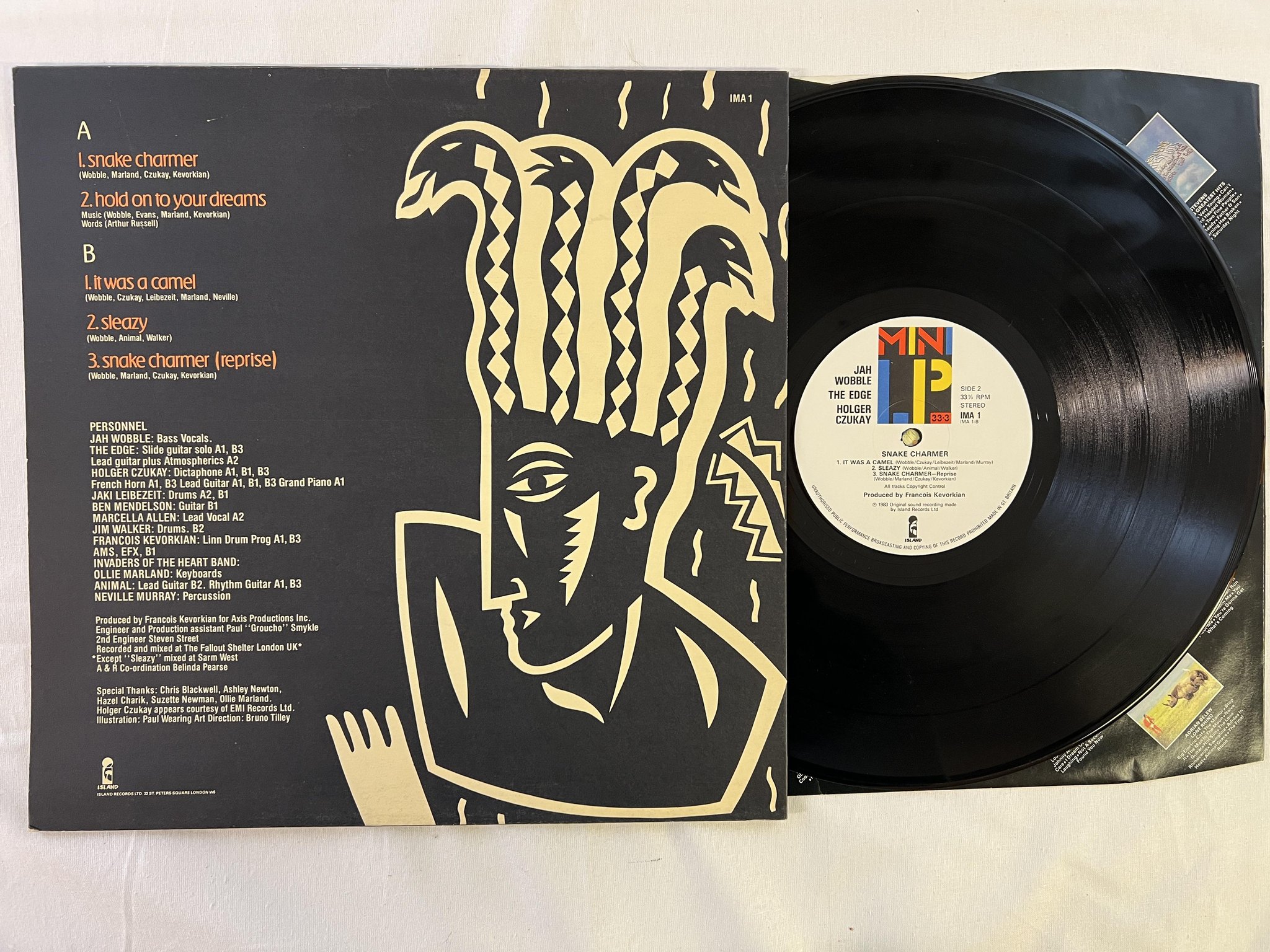 Omslagsbild för skivan JAH WOBBLE snake charmer MINI-LP -83 UK ISLAND ima-1 leftfield 