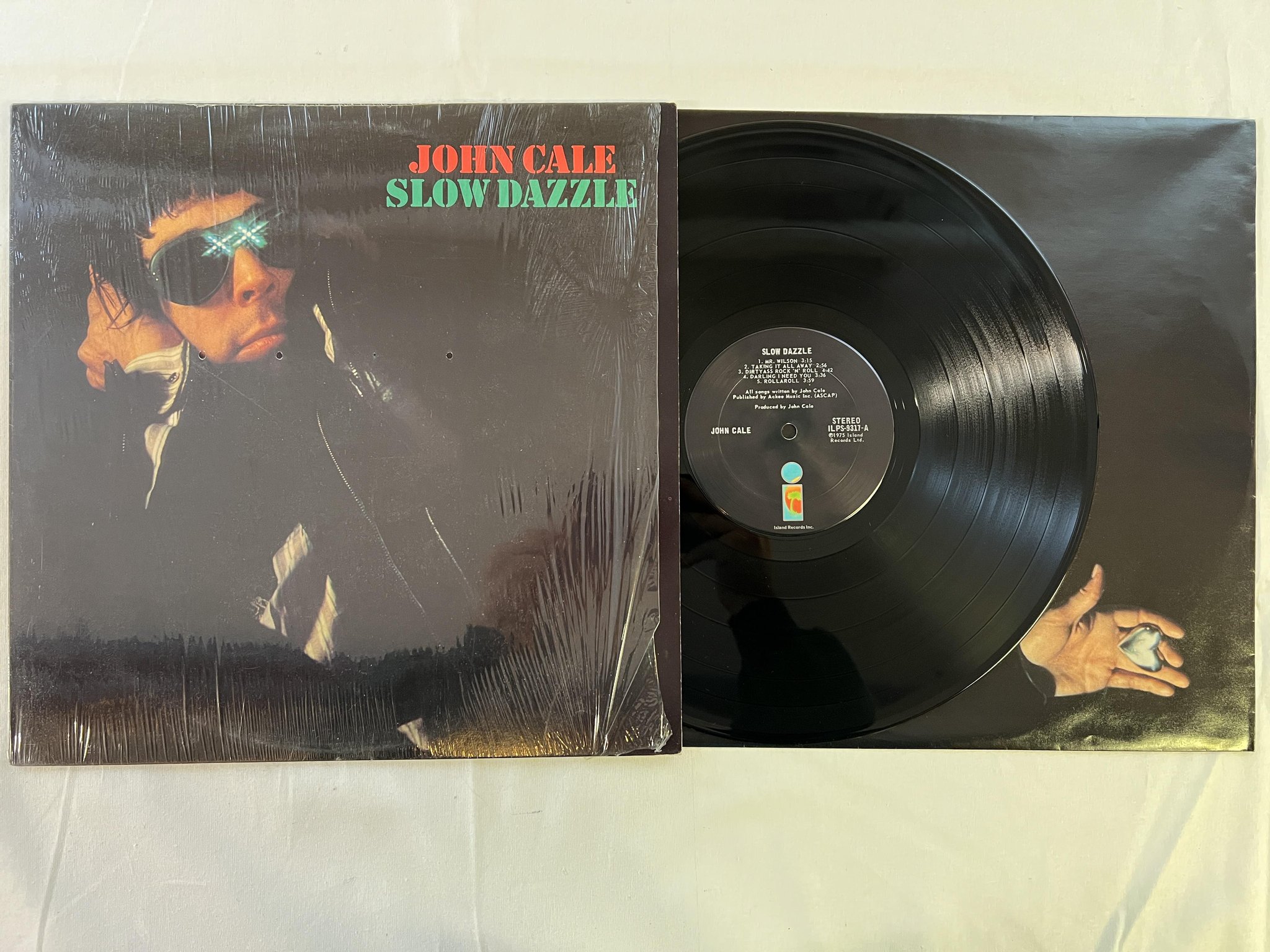 Omslagsbild för skivan JOHN CALE slow dazzle LP -75 US ISLAND ILPS 9317